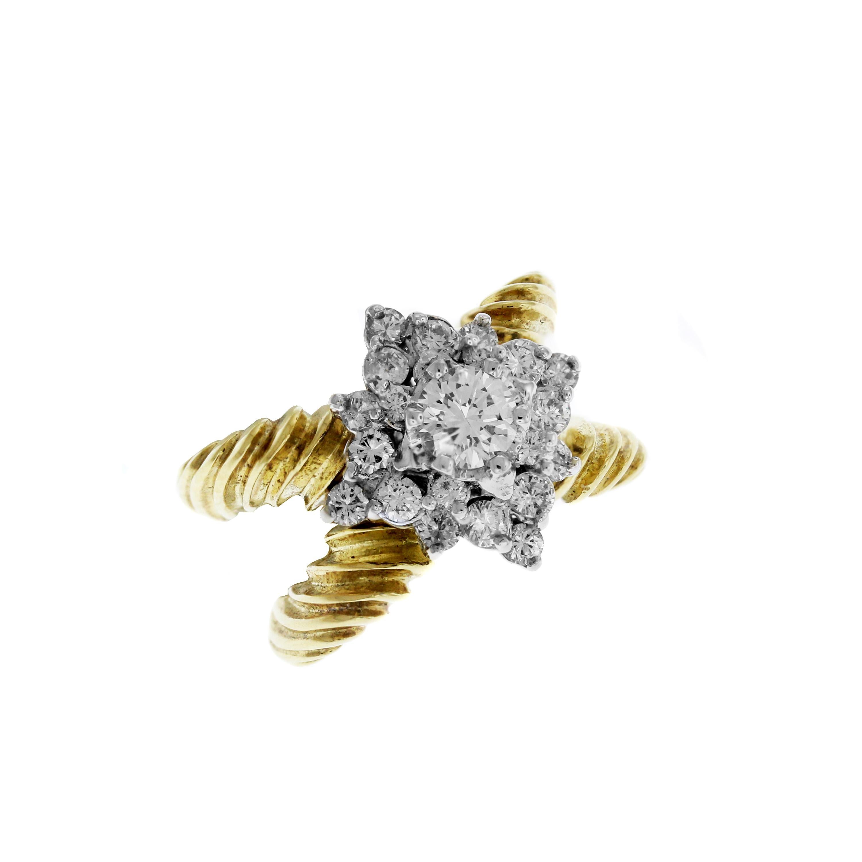 IF YOU ARE REALLY INTERESTED, CONTACT US WITH ANY REASONABLE OFFER. WE WILL TRY OUR BEST TO MAKE YOU HAPPY!

18K Yellow and White Gold X Ring with Diamond Cluster center

Bands are done with hand-twisted wiring in the shape of an X

1.50 carat G