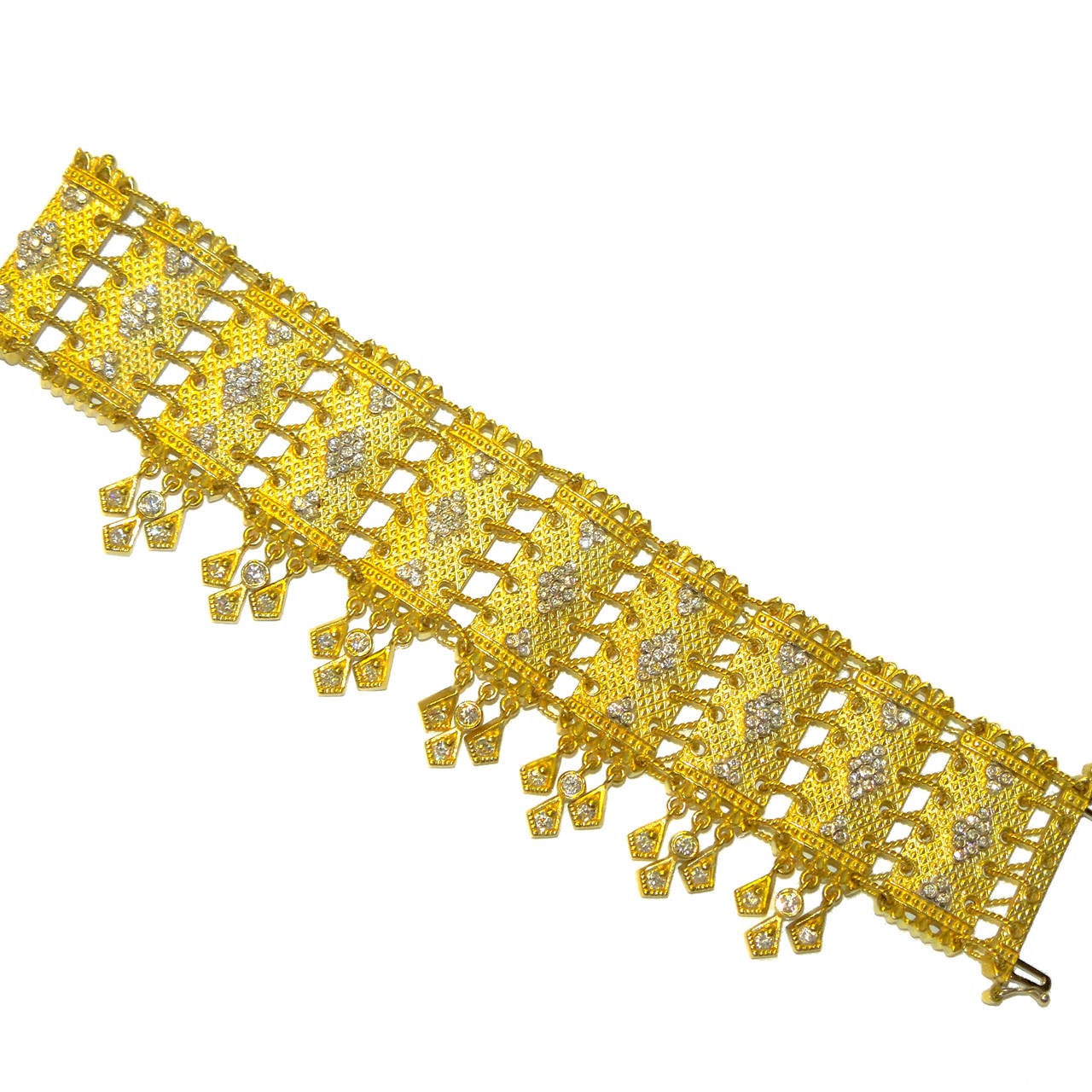 18K Gold Bracelet with Diamonds 

Hand twisted wires connects each part of this bracelet

Entire bracelet is put together by hand. Textured design is seen throughout the piece

Hanging diamonds below the bracelet

3.25 ct.'s of G Color, VS