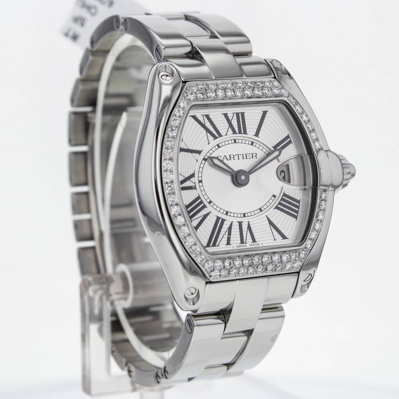 Ladies Cartier Roadster in Stainless Steel with Diamond Bezel, Quartz Watch. Manufacturer's papers and box not included.

Previously owned, excellent condition with expected wear. Cleaned and serviced.

36mm x 30mm in its case size and 9mm