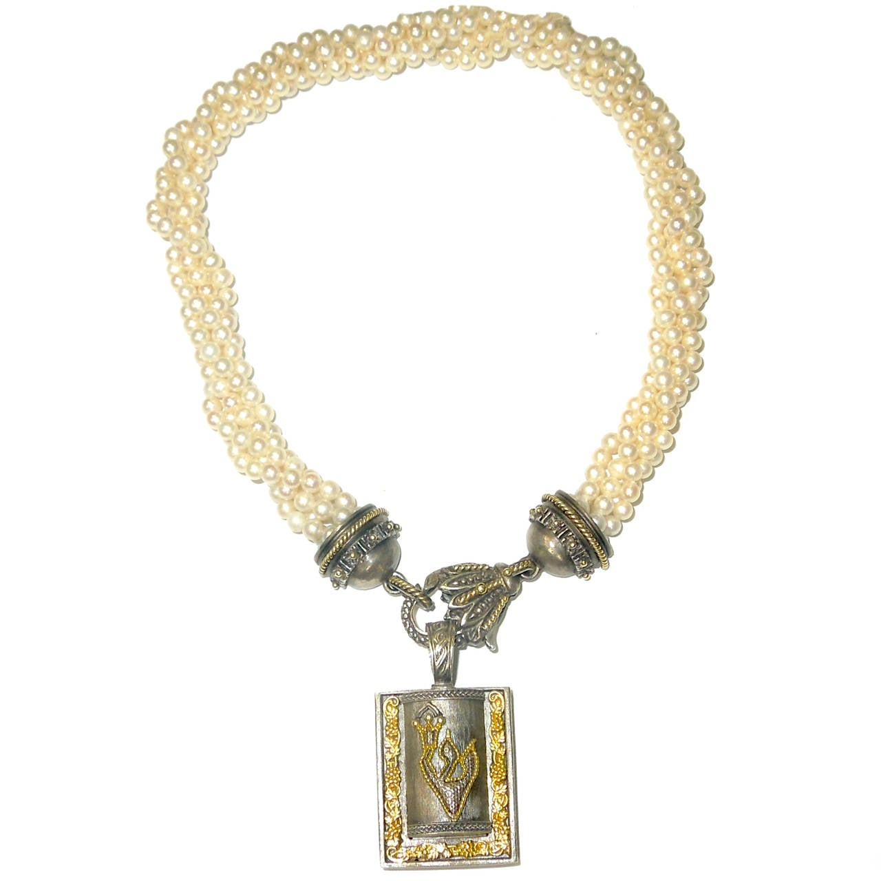 Aged Silver & 18K Gold Mezuzah hung on Fresh Water pearl necklace with Aged Silver clasp.

Mezuzah is a locket that opens and up to keep your prayers

Necklace is made up of 5mm Fresh Water pearls with Aged Silver & 18K Gold Lobster clasp, where