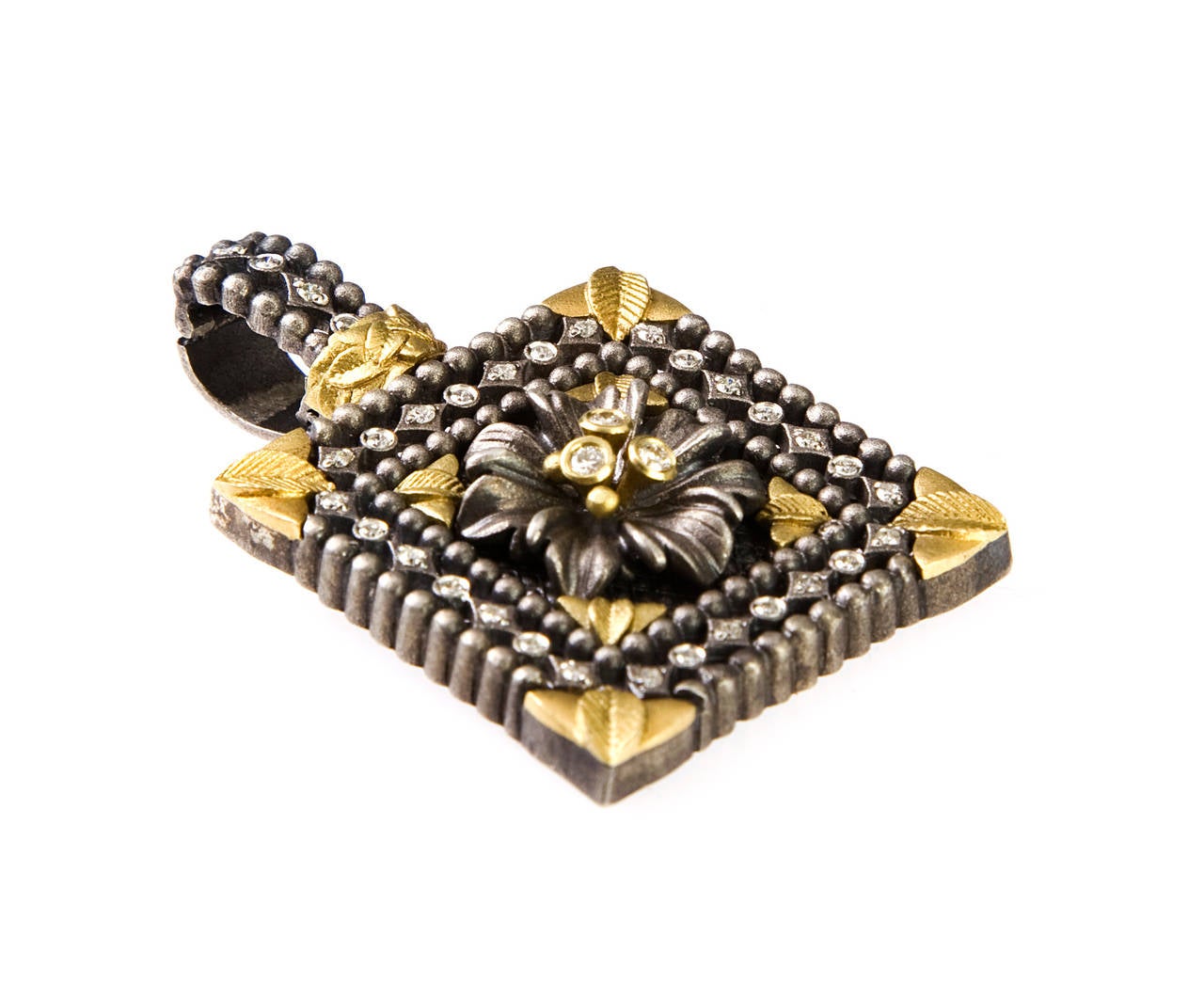 Aged Silver & 18K Gold and Diamond Floral Square Enhancer Pendant

Centered is a Organza Flower surrounded with Diamonds. 

0.44 carat diamonds

2 inches in length. 1.2 inches wide.

Signed STAMBOLIAN and has the Trademark 