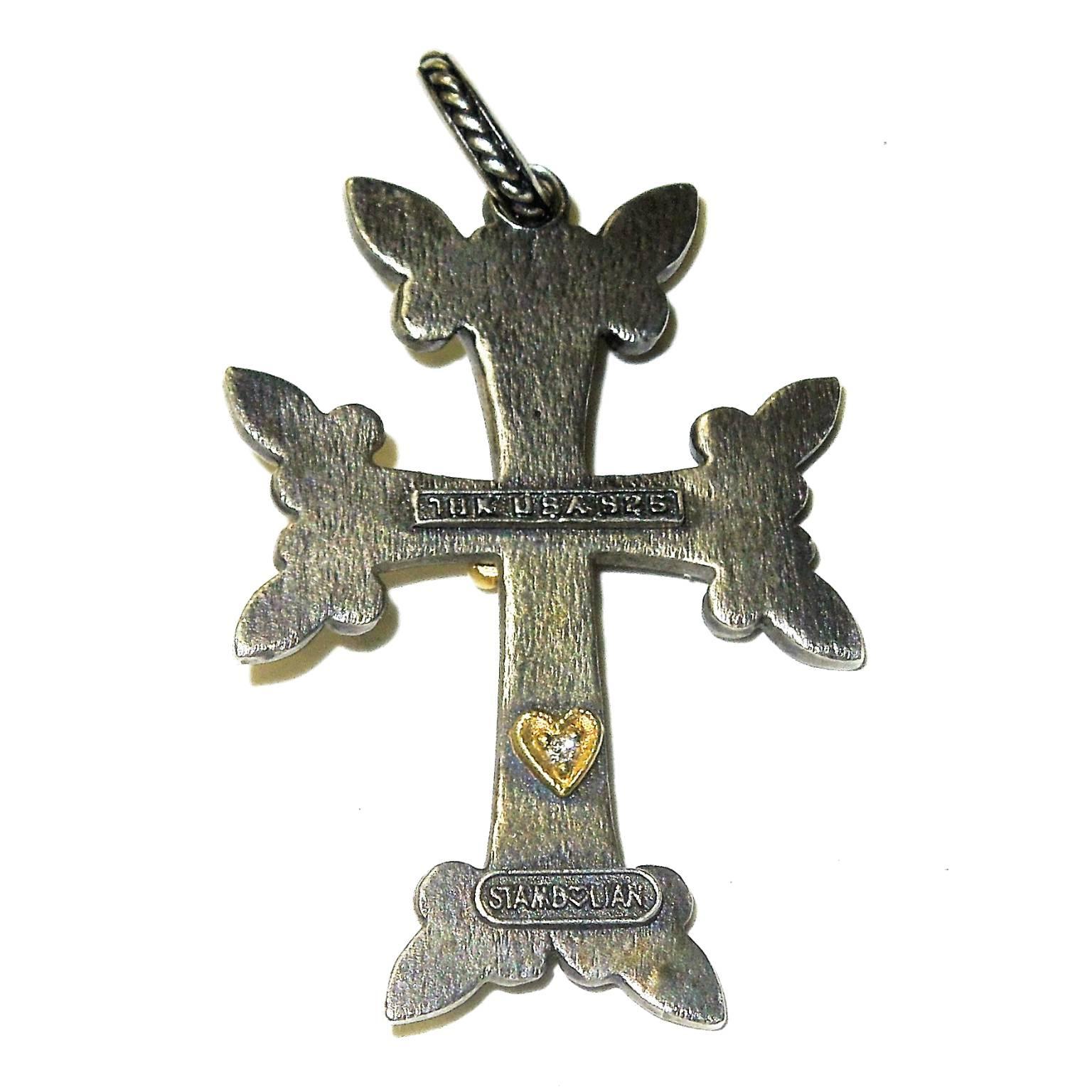 Aged Silver Cross with 18K Gold center with diamond

1.7 inch length

Single diamond center

Signed STAMBOLIAN with our Trademark "Diamond Heart"

Proudly Made in USA