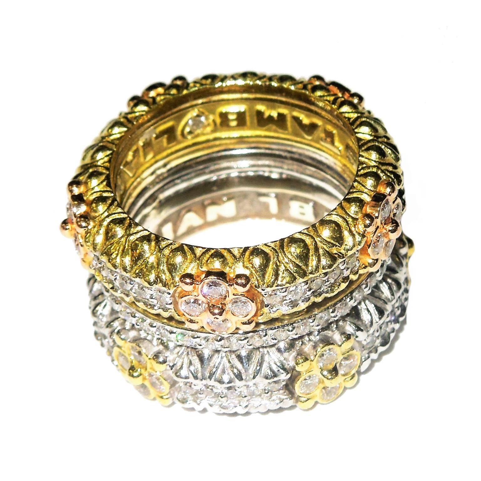 18K yellow, white and pink gold band ring with diamonds by Stambolian

1.72 ct. apprx. G color, VS Clarity Diamonds

One half is white gold with yellow gold bezels, other half is yellow gold with pink gold bezels, and center is simple diamond