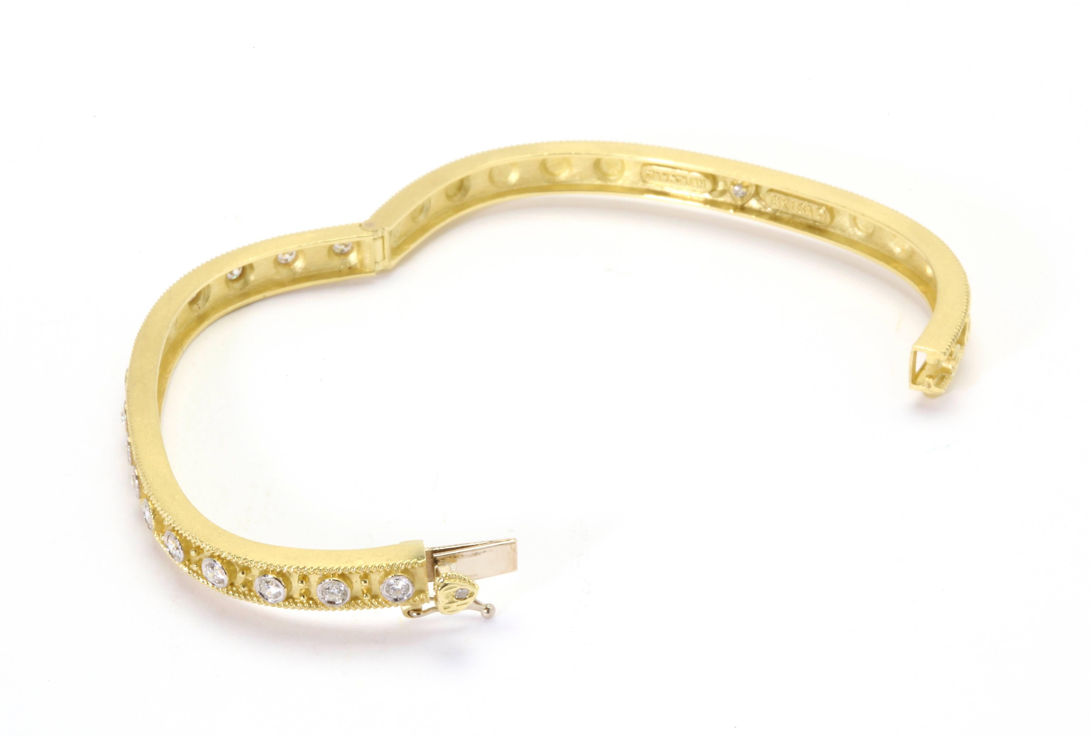 18K Gold Bangle Bracelet with Diamonds

16 Diamonds total, 0.82ct. G Color, VS Clarity diamonds

Size 7 but sizable

Push button clasp used with safety to open and close.

Signed STAMBOLIAN with our Trademark 