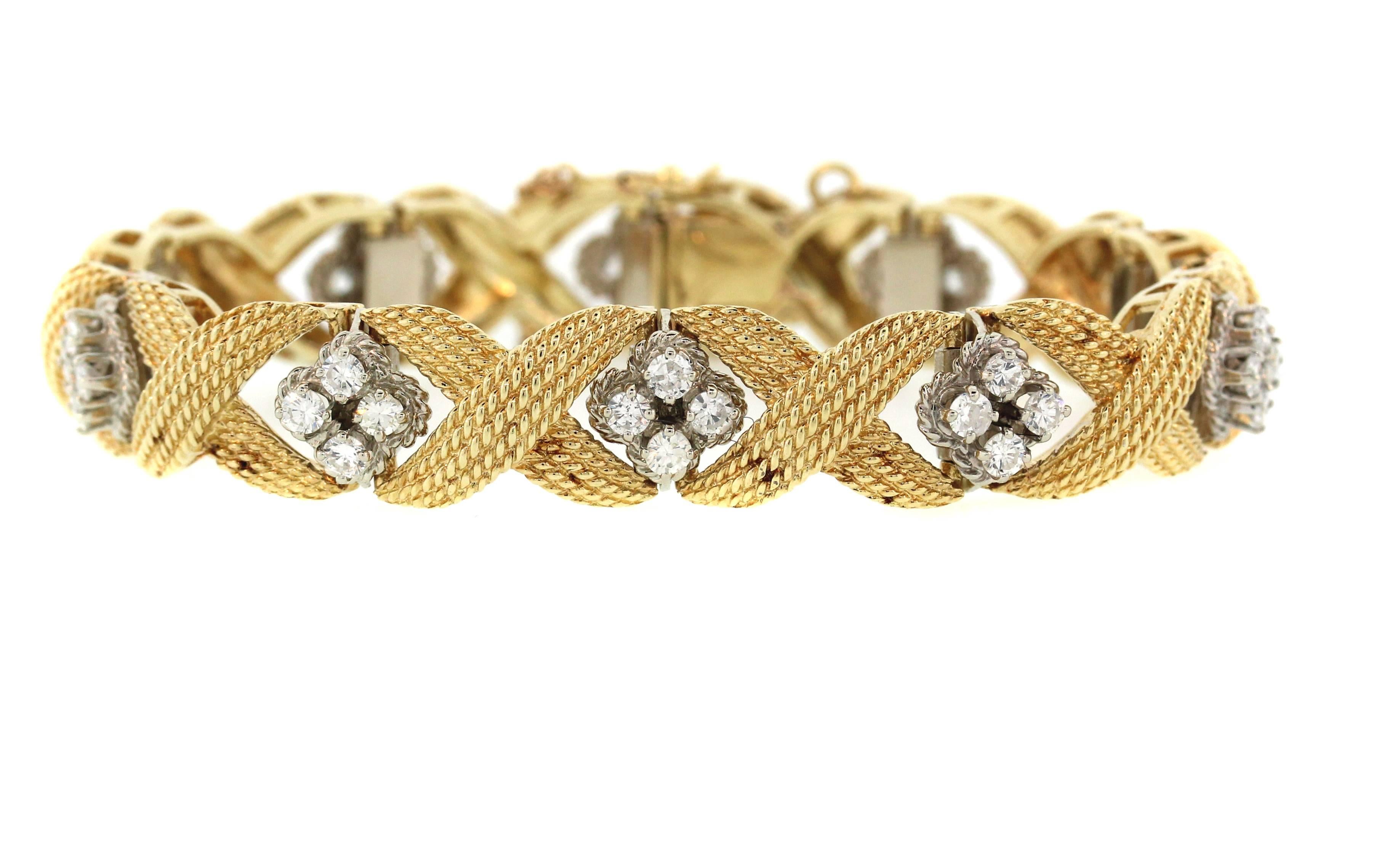 18K Gold Bracelet with Diamond Clusters

Apprx. 3.00ct Diamonds throughout entire bracelet

41.1 grams solid 18k gold

7 inches length, 0.45 inch width

Push Button clasp with chain as safety

Estate

