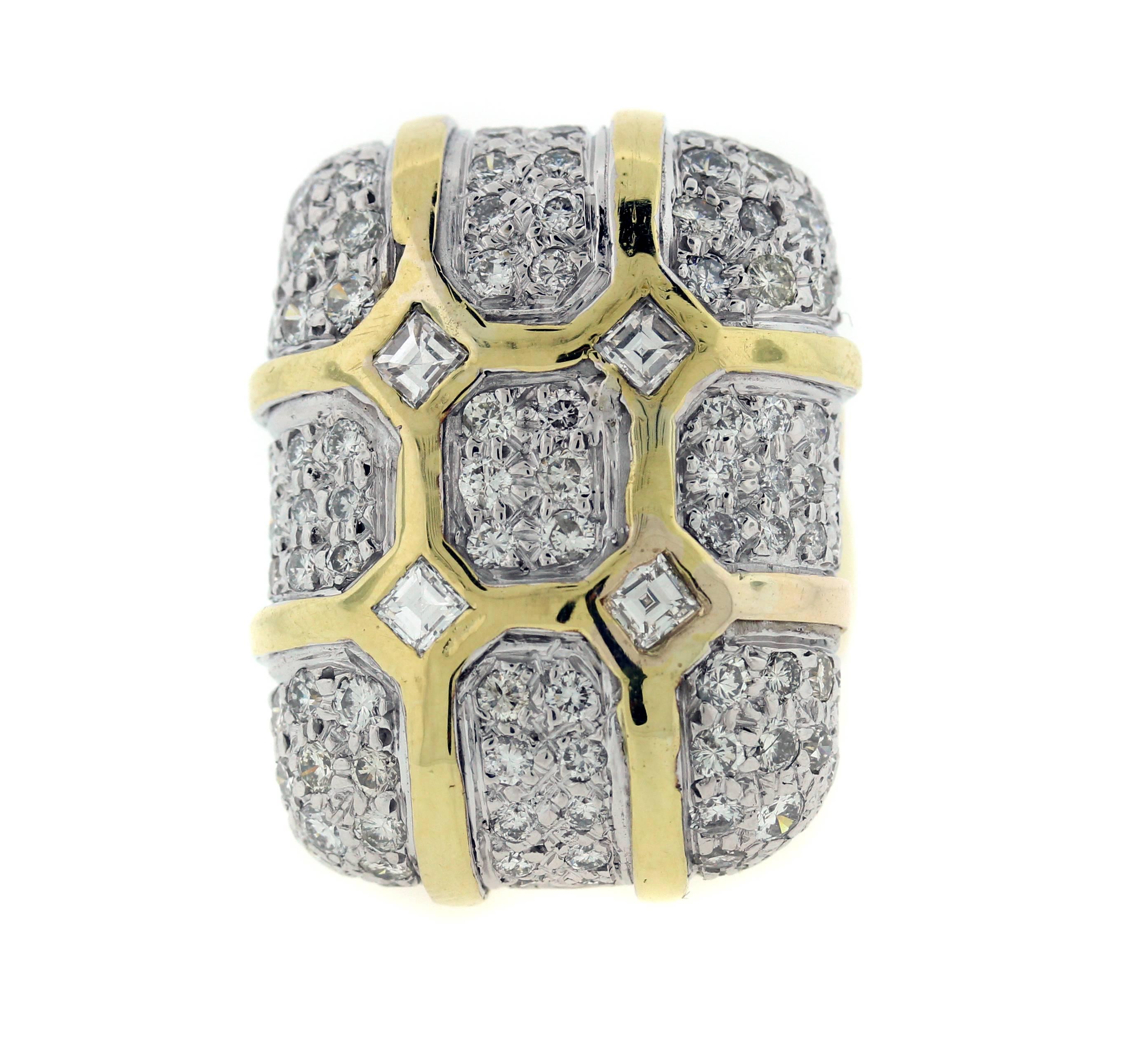 18K Gold Ring with Diamonds

Apprx. 4.25ct. Diamonds

Face of ring is 1.2 length, 0.95 width

0.25 inch Band Width

36 grams 18k gold

Currently size  8.25. Can be sized