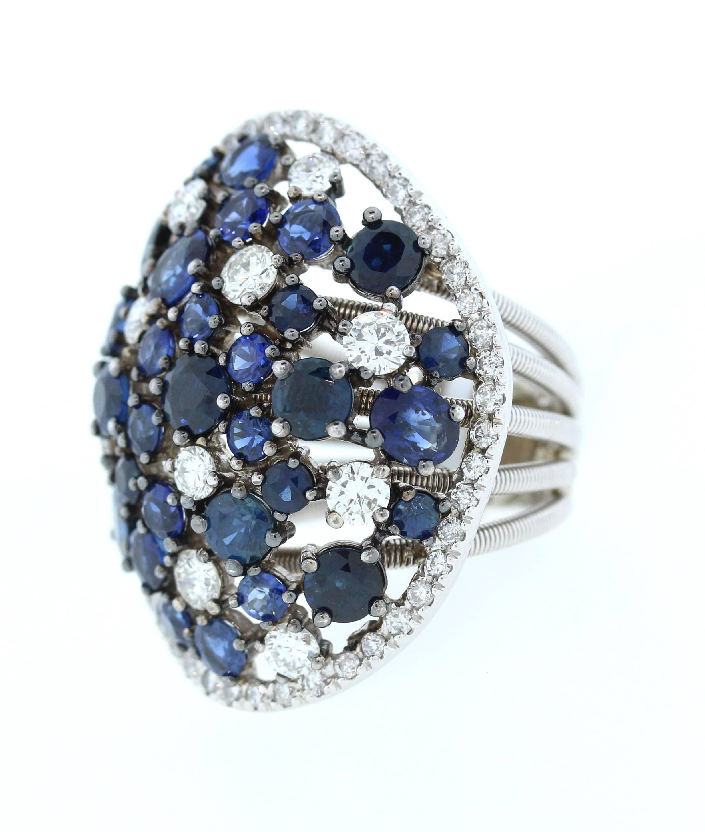 14K White Gold Ring with Blue Sapphires and Diamonds

Apprx. 11ct. Blue Sapphires

Apprx. 2.20ct. White Diamonds

0.5 inch band width. 1.2 inch Face length. 1.2 inch Face width

16.8 grams 

Currently size 6.5. Can be sized.