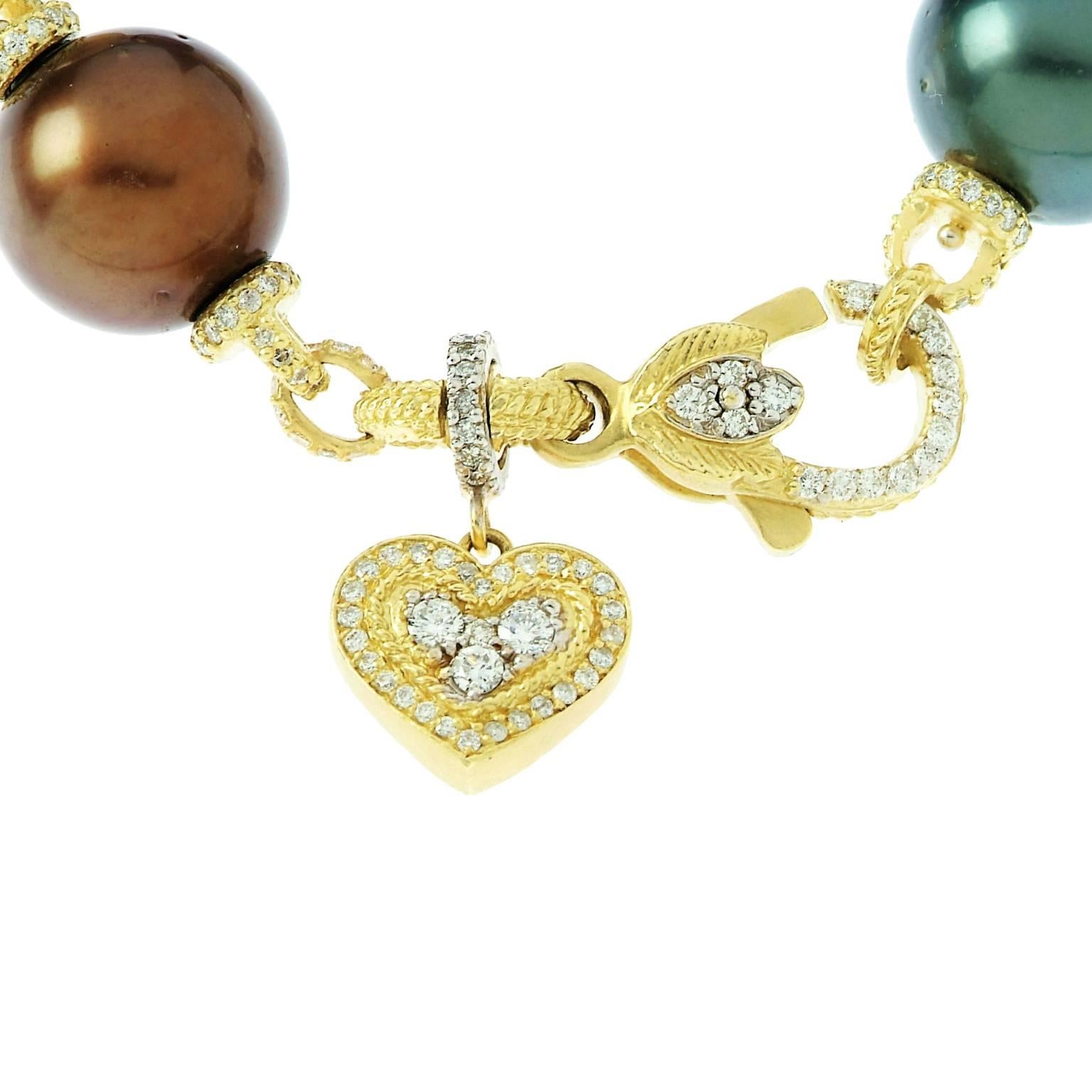 18K Gold Bracelet with South Sea Pearls and diamonds with dangling heart by Stambolian
  
Diamond links in between each pearl 

3.96ct. G Color VS clarity diamonds  

Six, 14mm, South Sea Pearls AAA Quality 
 
Entire piece is covered in diamonds,