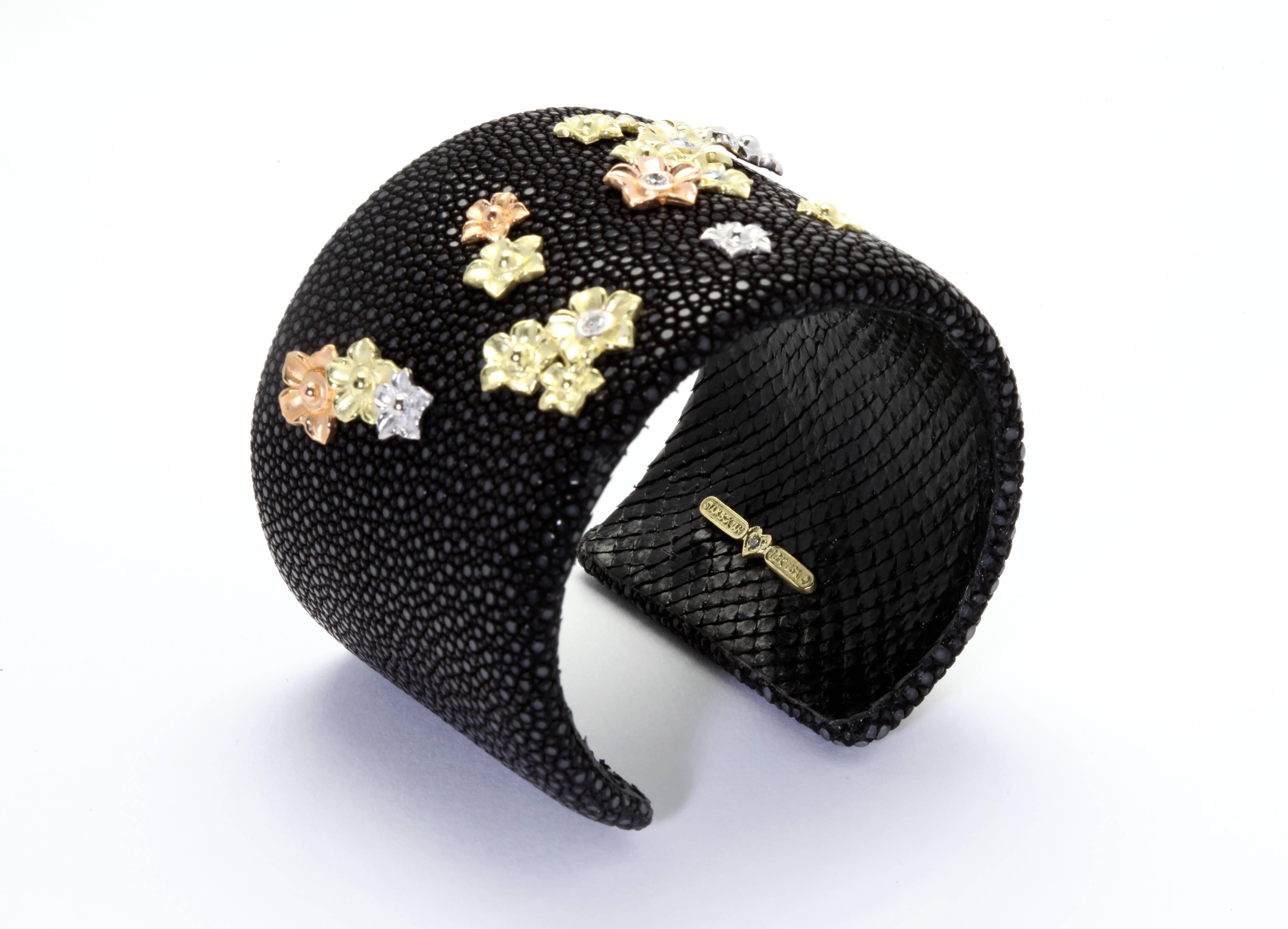 Stingray Leather Bracelet with 18K Gold and Diamond flowers 

ONE OF A KIND

0.41 ct G Color VS Quality diamonds

1 of the flower bezels moves around

Signed Stambolian with our Trademark 