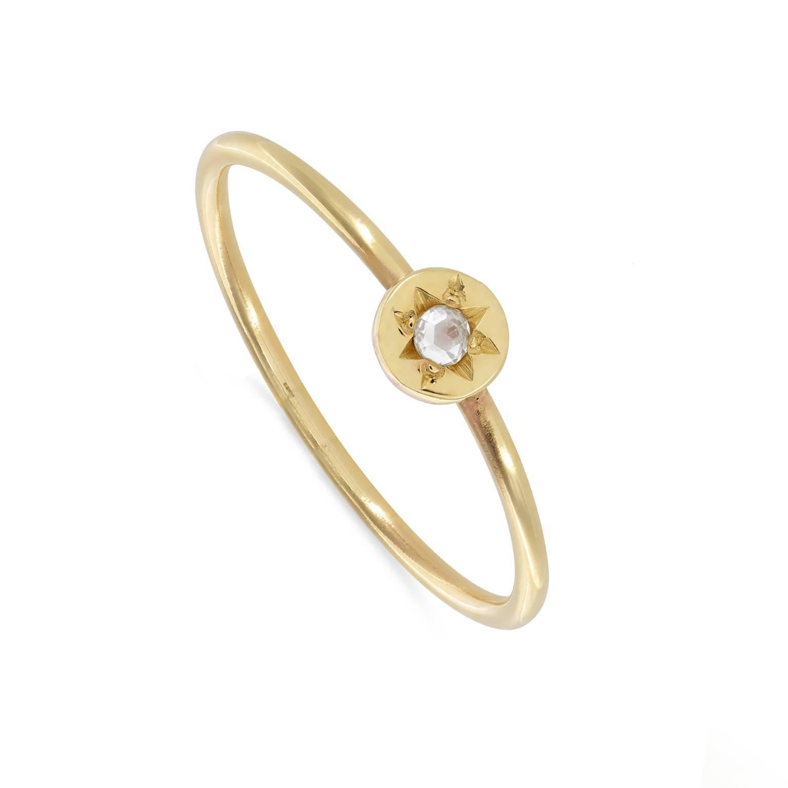 A stacking ring fit to be a promise ring, 9ct gold with a disc of gold set with a white rose cut diamond. Stack easily with your other rings or wear on its own for a simple piece of elegance.

This ring is size N (US 7) but can be resized. Please