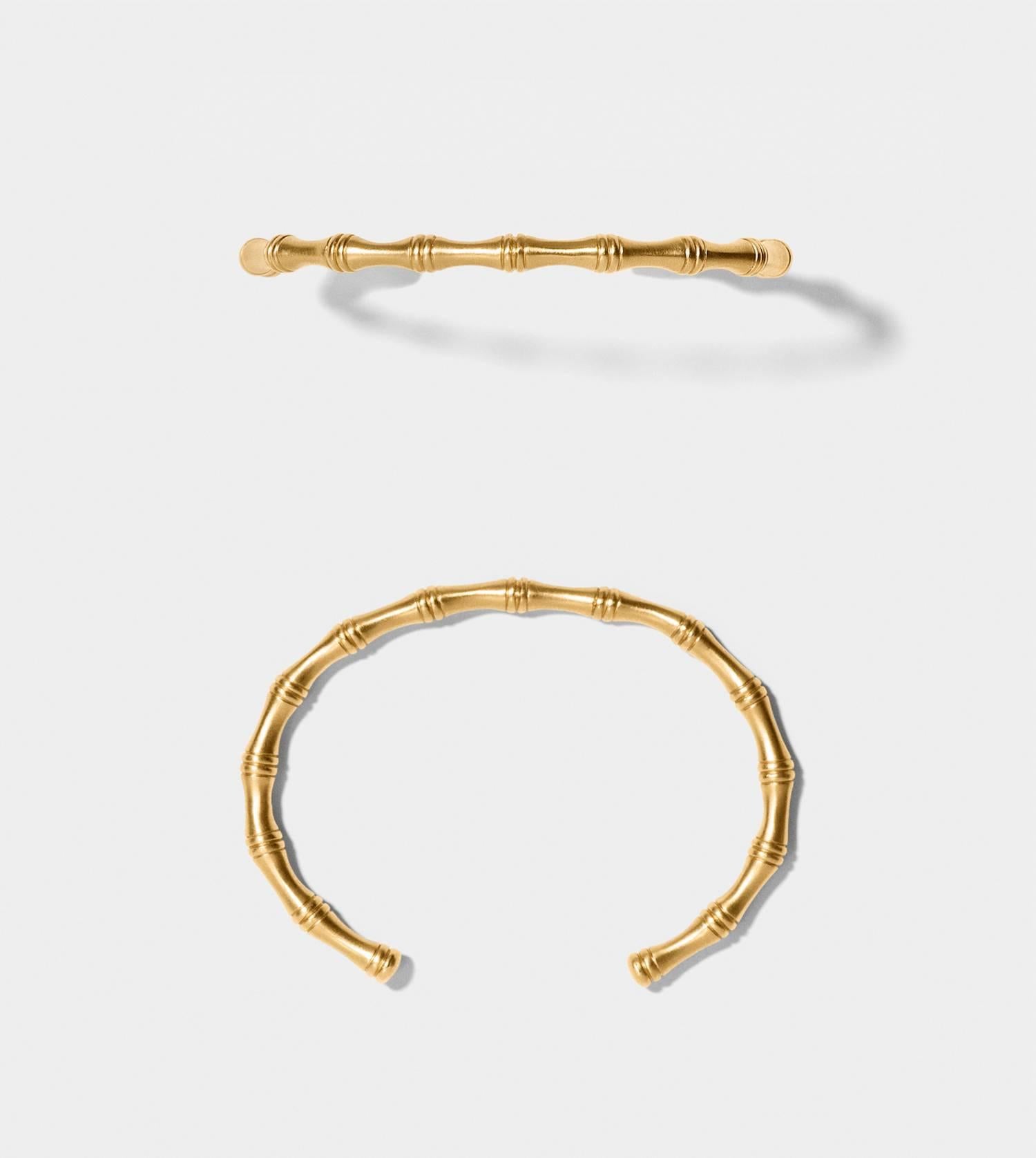 MISS BEDELIA
Open bangle of silk matte 14 karat solid gold.     
Inspired by the elegant and iconic lifestyle of colonial India and Karen Blixen's Africa, BAMBOO COLLECTION is nature and history turned into fine jewellery. Exquisite bamboo furniture