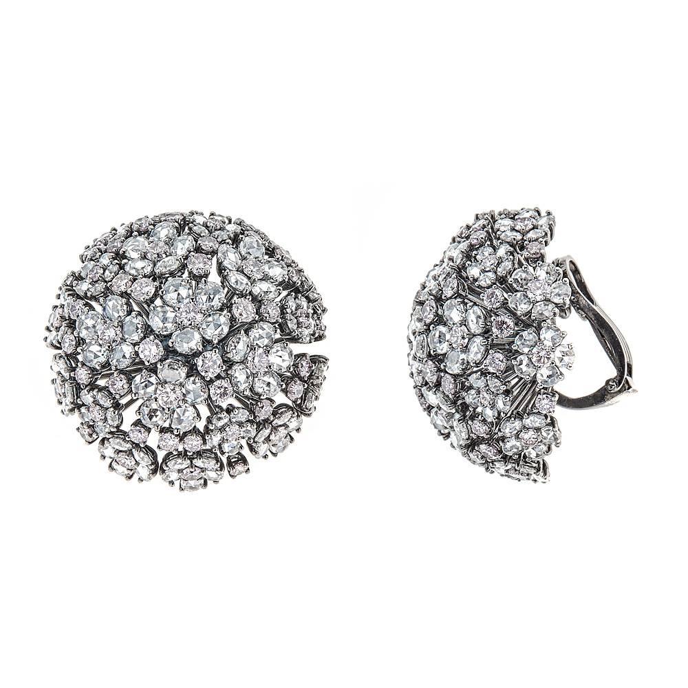 With effortless style these one of a kind earrings boast 8.77 carats of beautiful, light Pink Diamonds and 16.38 carats of rose cut White Diamonds. For a mesmerizing, unparalleled look these pieces are set in rhodium dipped 18K White Gold that draws