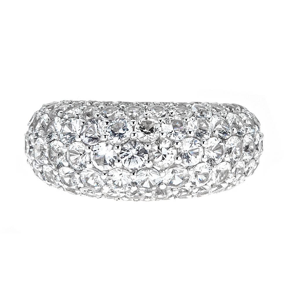 An exquisite 18K White Gold dome ring. Though set with 10.30 carats of round White Sapphires, this piece bears a beautiful resemblance to brilliant white diamonds, making it a perfect ring for casual or evening wear. 

Features: This style is