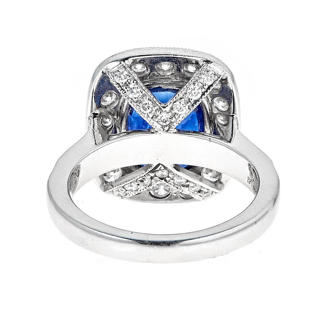 Oval Cut GIA Certified 4.09 Carat Blue Sapphire and 1.40 Carat Diamond Platinum Ring For Sale