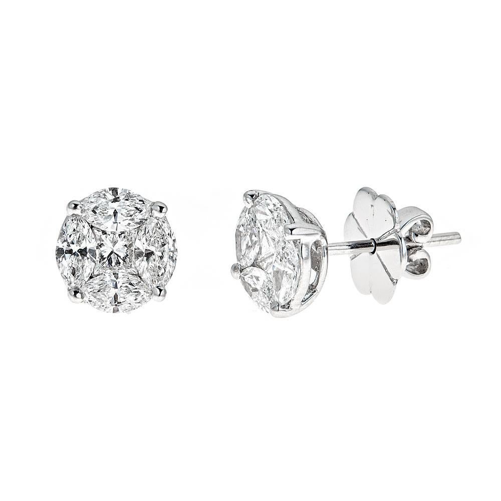 Stunning, chic and timeless, these 18K White gold stud earrings are an inventive take on a classic style. 2.00 carats of expertly cut radiant and marquise Diamonds give the flawless illusion of two large stones to create these effortless wardrobe