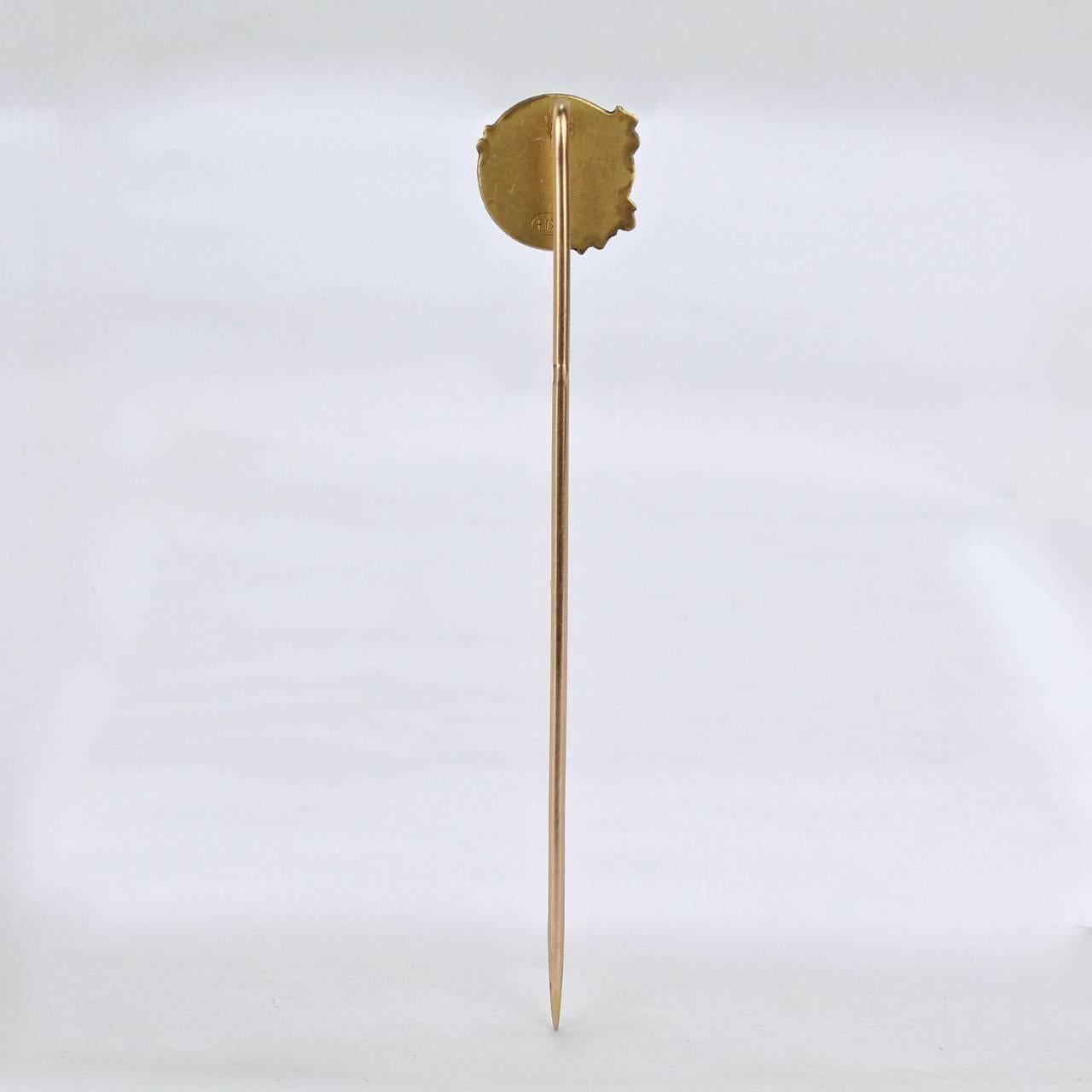 A fun, antique Art Nouveau 18-karat rolled gold (gold filled) lapel or stick pin.

It was modeled by the French sculptor Emile Dropsy for the famous Bijoux Fix line of gold-plated or 'laminated' jewelry by Maison Savard of Paris. Savard began