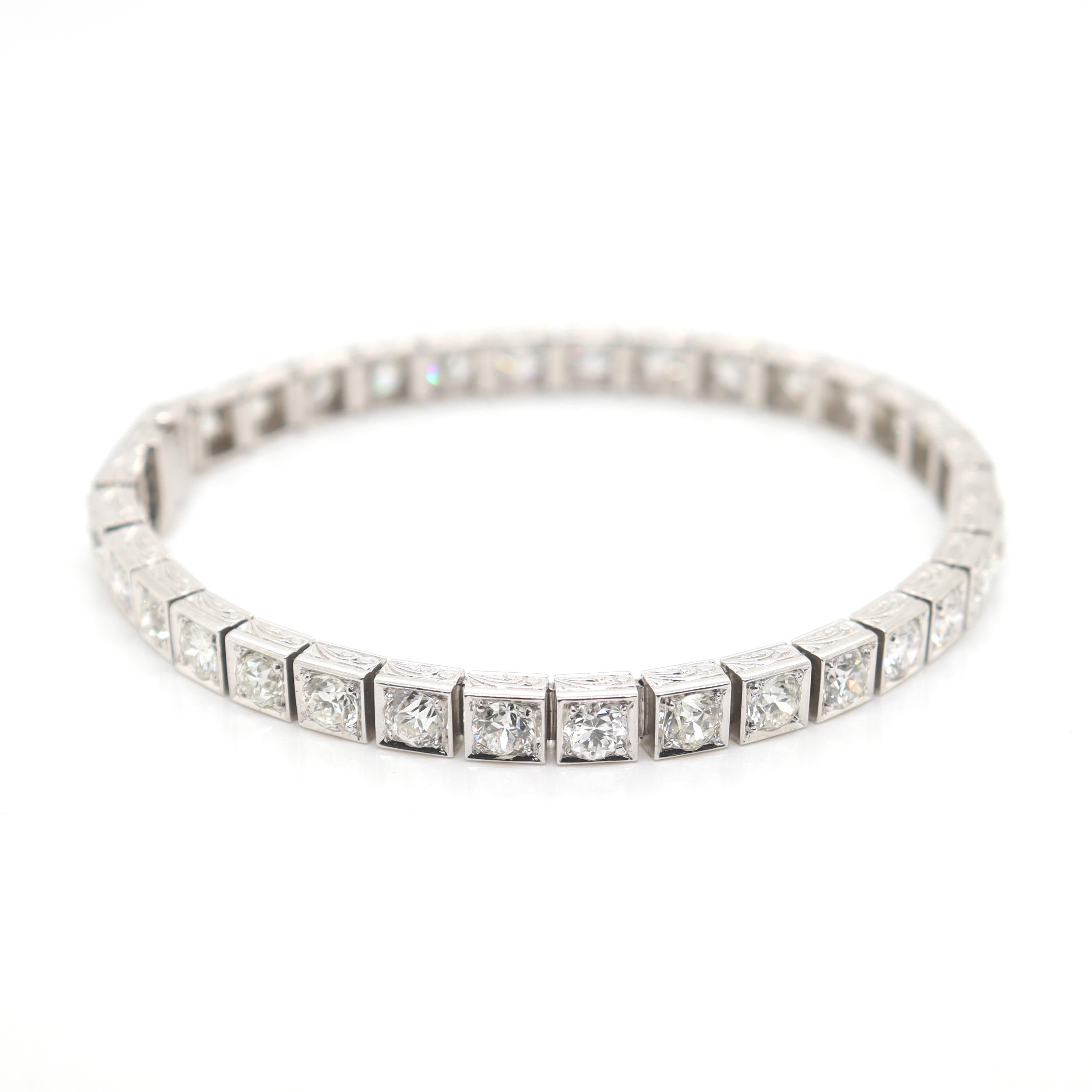A very fine antique Art Deco period diamond and platinum tennis bracelet.

Set with 34 Old European and Transitional Round Brilliant cut diamonds with an approximate 10.65 total carat weight, VVS-VS clarity, G-H-I color. Each prong set in a square