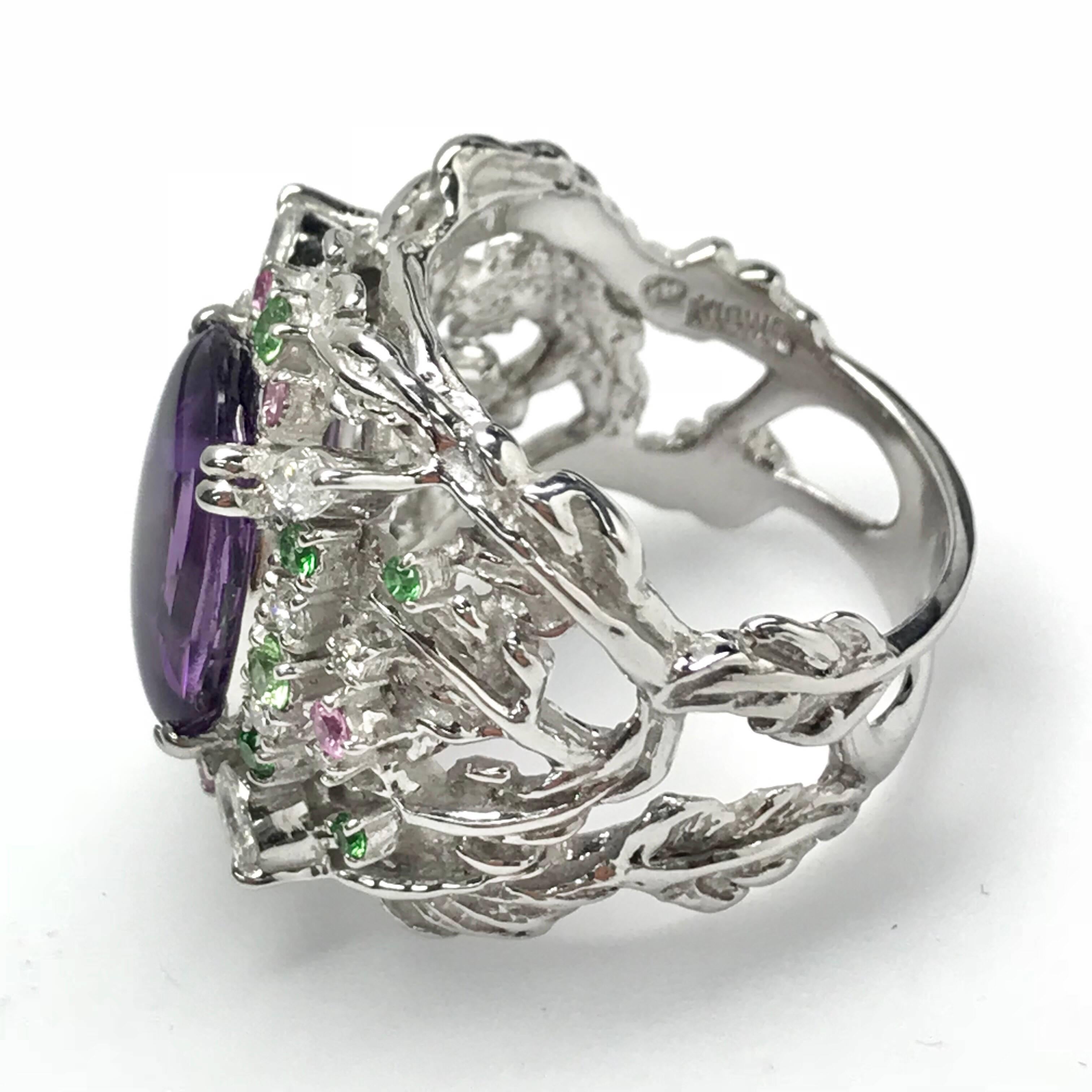 All buyers outside of Japan will receive -8% tax exemption from the list price. 
Please inquire for details.
Amethyst : 5.54ct / Green Garnets : 0.33ct / Sapphires : 0.15ct / Diamonds : 0.42ct 
Approximate Size of the center stone : L14mm