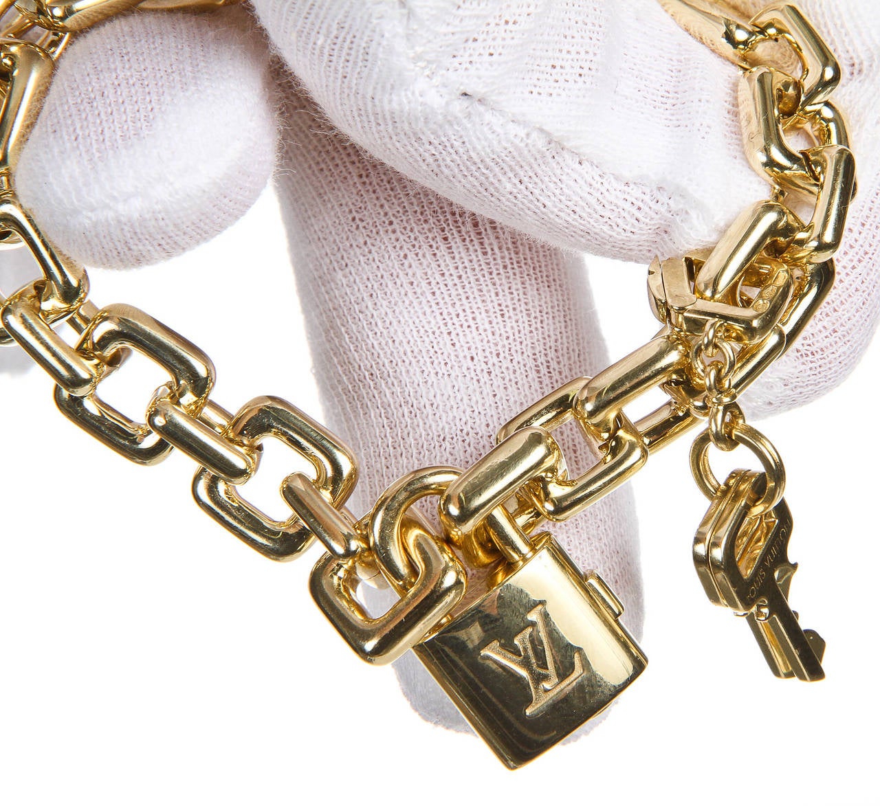 Louis Vuitton Gold Keys and Padlock Bracelet at 1stDibs  lv bracelet clover,  clover lv bracelet, lv padlock bracelet price