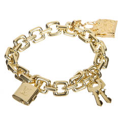 Louis Vuitton Padlock and Keys+ Two Bags Charm Yellow Gold Bracelet 125.7  Gm 18 KG For Sale at 1stDibs