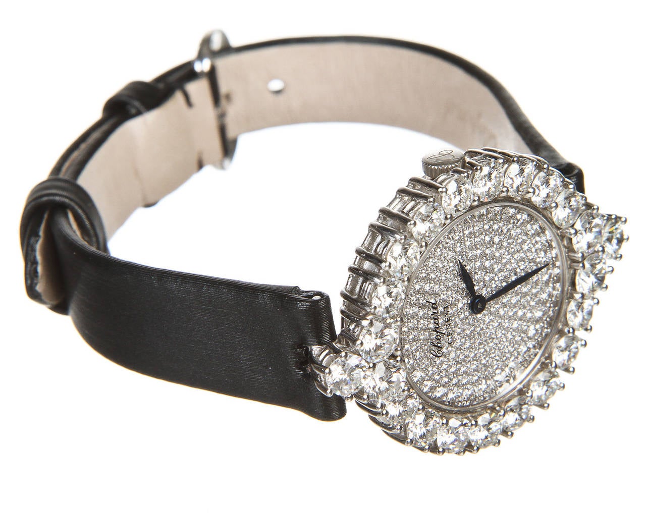 Can you imagine unwrapping this little beauty? This distinctive Chopard diamond watch adds a touch of refined class to any ensemble. This watch has been crafted from 18k white gold and features a very unique face. The pin closure clasp means that