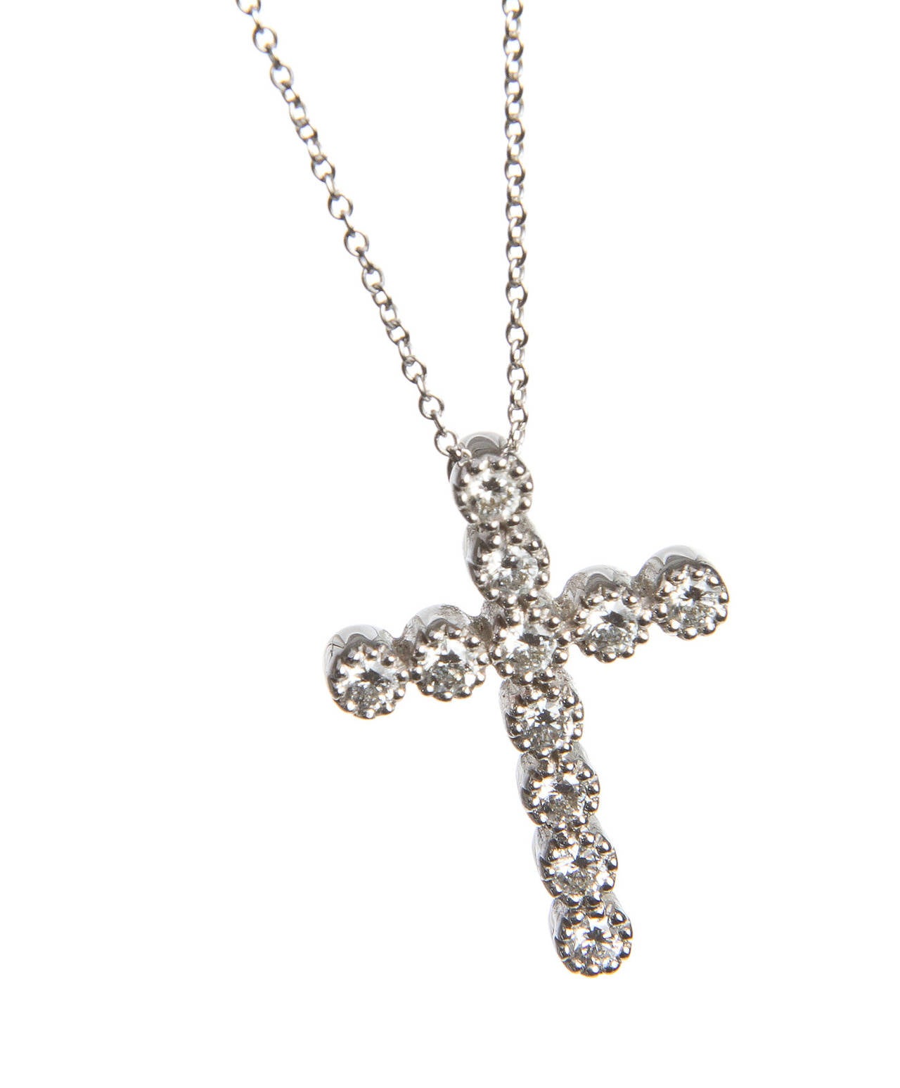 This beautiful diamond cross necklace from Kwiat can easily be yours today. This fabulous necklace has eleven diamonds, set in a beaded bezel.