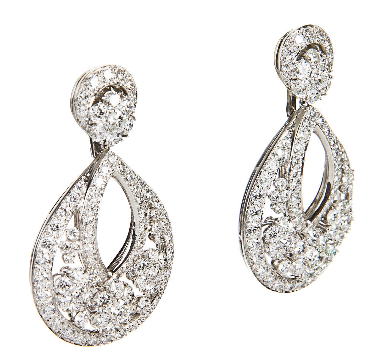 Seen here are these absolutely stunning Van Cleef & Arpels Platinum and Diamond Snowflake Earrings. These beautiful earrings are from the Snowflake Collection and were originally created in the 1940s. These same earrings were featured on the hit