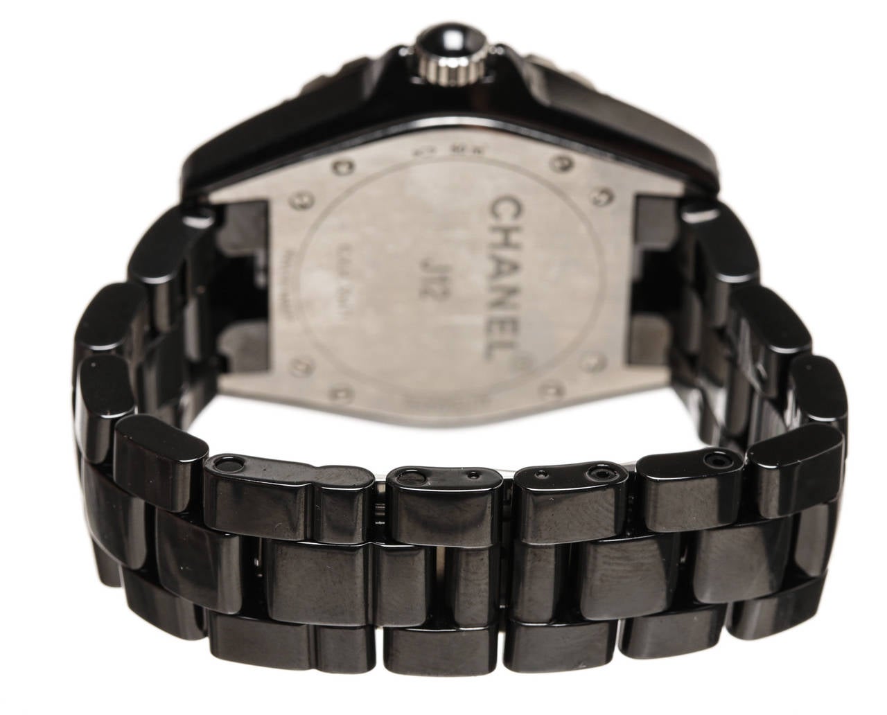 This stunning Chanel black ceramic J12 33mm watch combines classic style with class. Crafted from high-gloss high tech black ceramic, this watch has a black face with white Arabic and diamond numeral hour markers. The ceramic finish is extremely