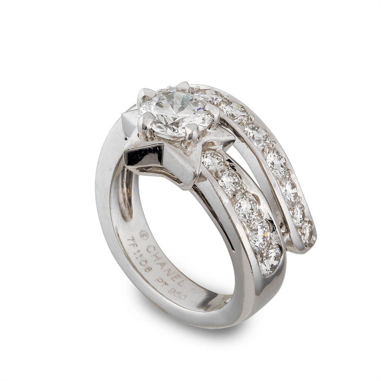 Lavish your collection with an elegant platinum and diamond ring from Chanel! This captivating ring from Chanel's Comete Collection features a wrapping band of diamonds accented by star.