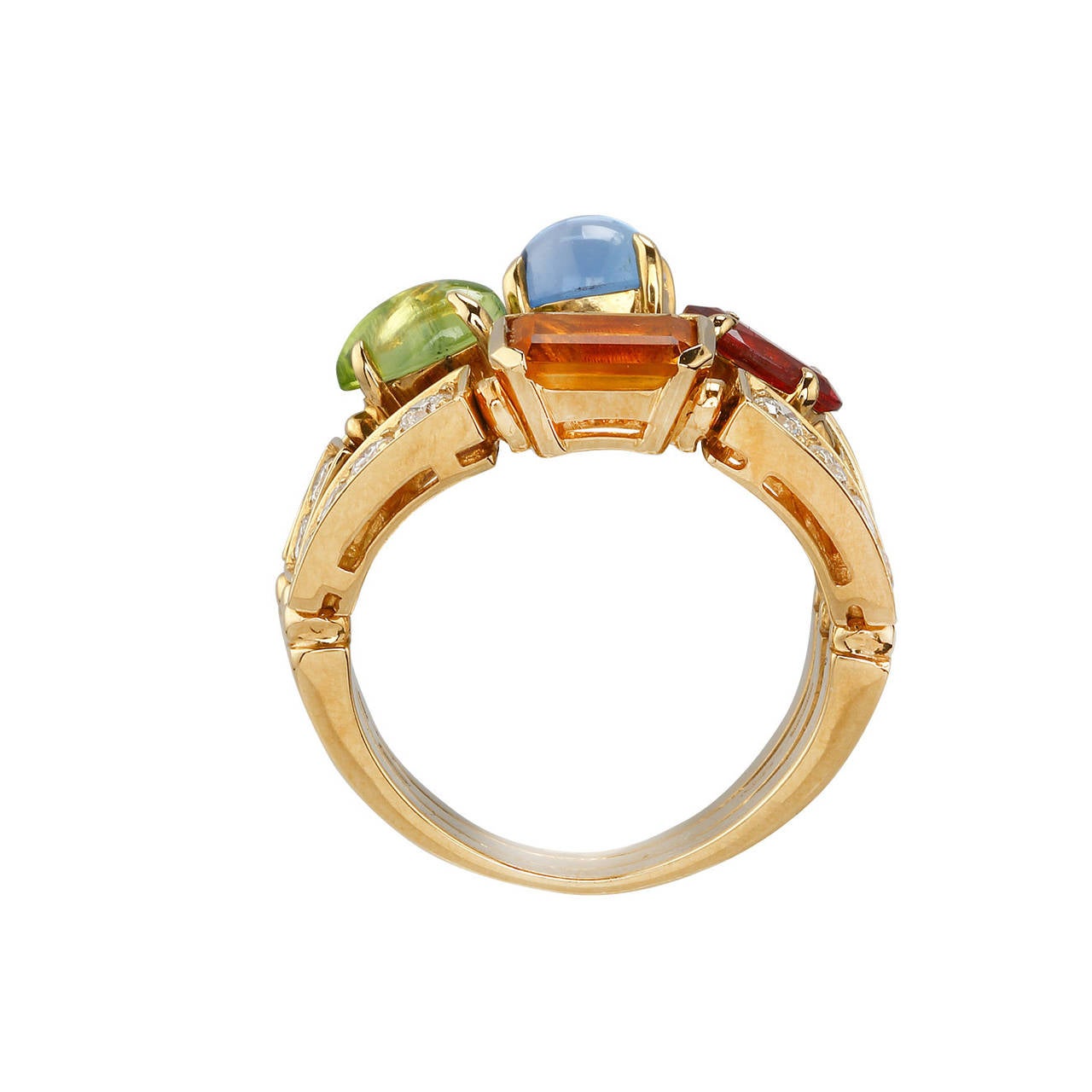 If you are looking for a ring that is truly going to shock and awe the crowd, look no further than this amazing Bulgari three band ring. This ring is from the Color Collection. It has been crafted from 18k yellow gold and features gorgeous pave