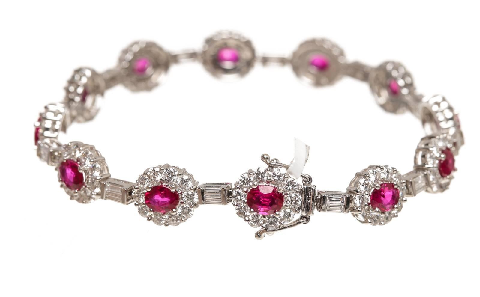 Crafted from 14k white gold, this bracelet is surrounded by diamonds and ruby's.The ruby's weigh approximately 10.3 carats. Approximately 5.96 carats of diamonds.