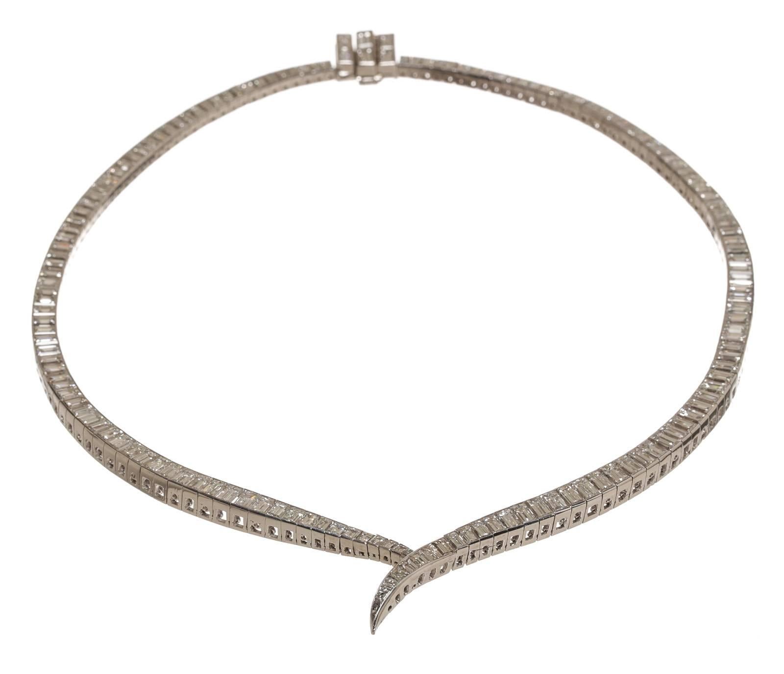Featured here is this beautiful platinum and diamond necklace. This necklace weighs approximately 56.1 grams and is cast manufactured of traditional design and bright finish. It measures 14.5 inches x 4.mm. Channel set are 158 straight baguette