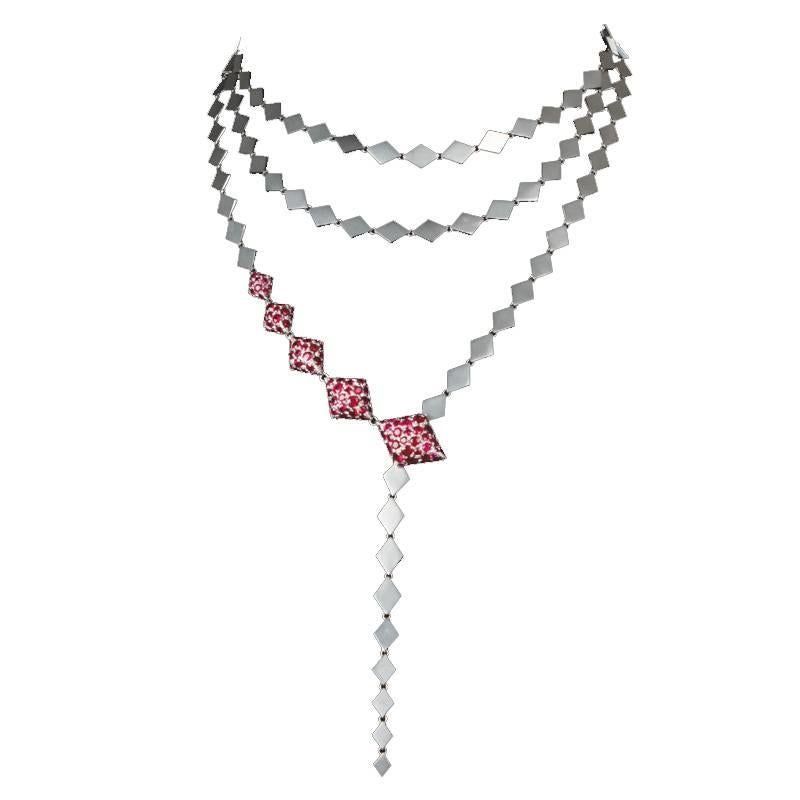 Youmna's 18K White Gold and Rubies suite comprises of a ring from her Ballet Russes Collection matched with a necklace and earrings from her Harlequin Collection. The Ballet Russes Ring was inspired by the groundbreaking 20th-century ballet company.