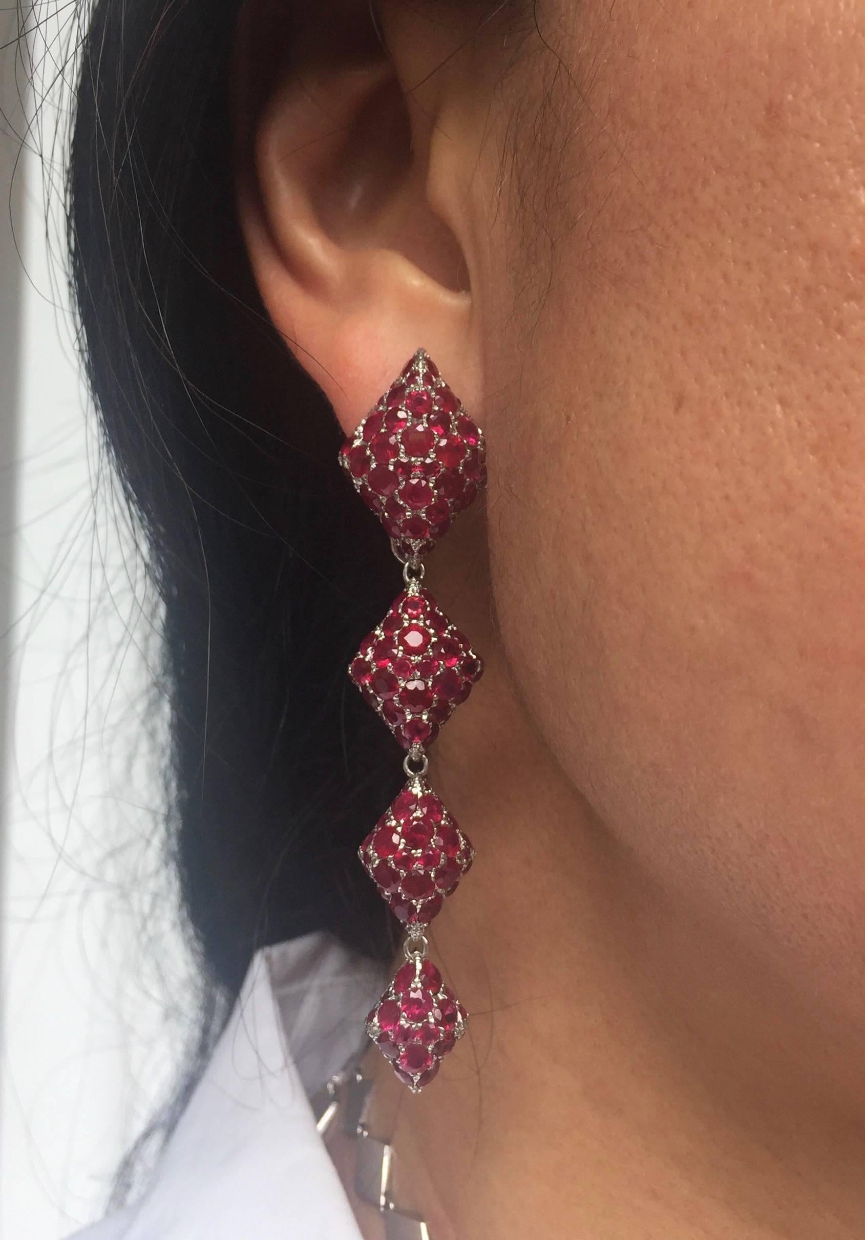 Metal: 18K White Gold  
Precious Stones: Rubies (approximately 20cts) 
Please allow for slight variations in measurements as pieces are handmade.

Youmna's 18K White Gold and Rubies Harlequin Earrings is set with nearly 20 carats of rubies,
