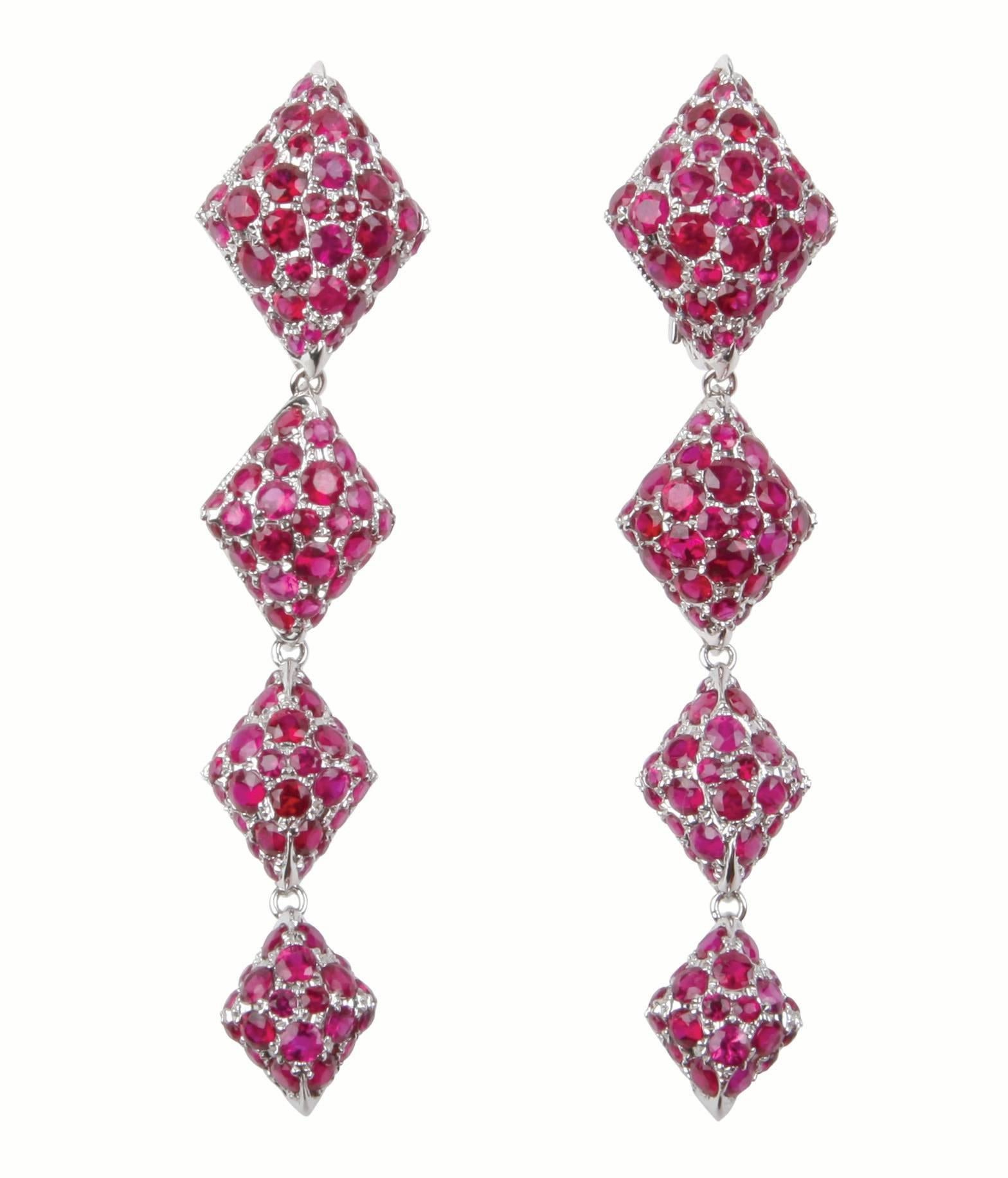 Metal: 18K White Gold 
Precious Stones: Rubies (approximately 10cts)
Please allow for slight variations in measurements as pieces are handmade.

Youmna's 18K White Gold and Rubies Harlequin Stud Earrings are set with nearly 10 carats of rubies,