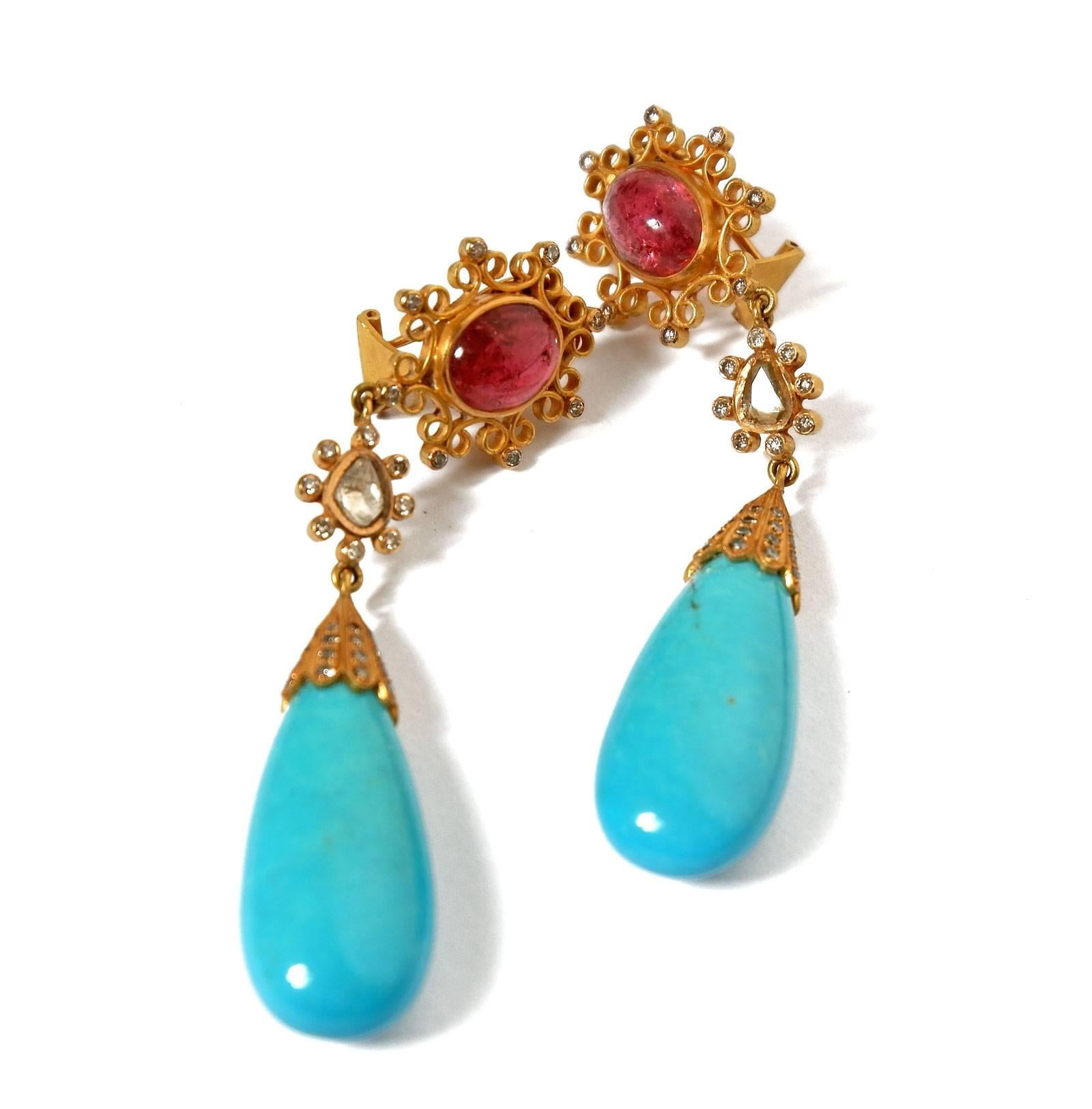 Hand crafted spectacular diamond, tourmaline and turquoise earrings. 18 karat gold. The cabochon rubellite tourmalines are surrounded by intricate diamond set gold scroll work. Two foiled backed flat cut diamonds surrounded by smaller diamonds. Two