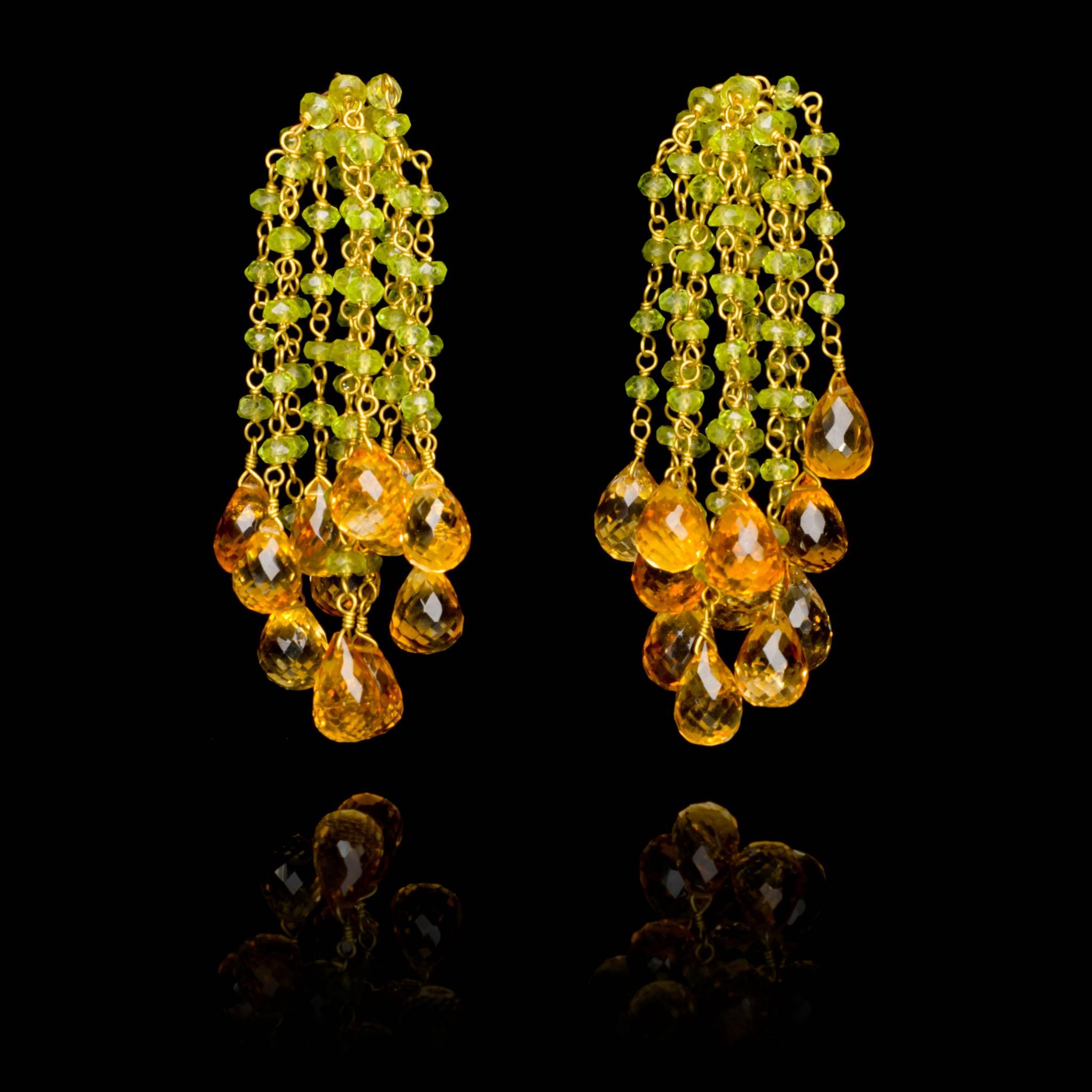 A pair of stylish hand crafted 18 karat gold Waterfall peridot and citrine bead earrings. Wear them on their own or with our matching gold and peridot bead cuff. Earring length is 6cm, 2.36in. 

The same design is available with red spinel beads and