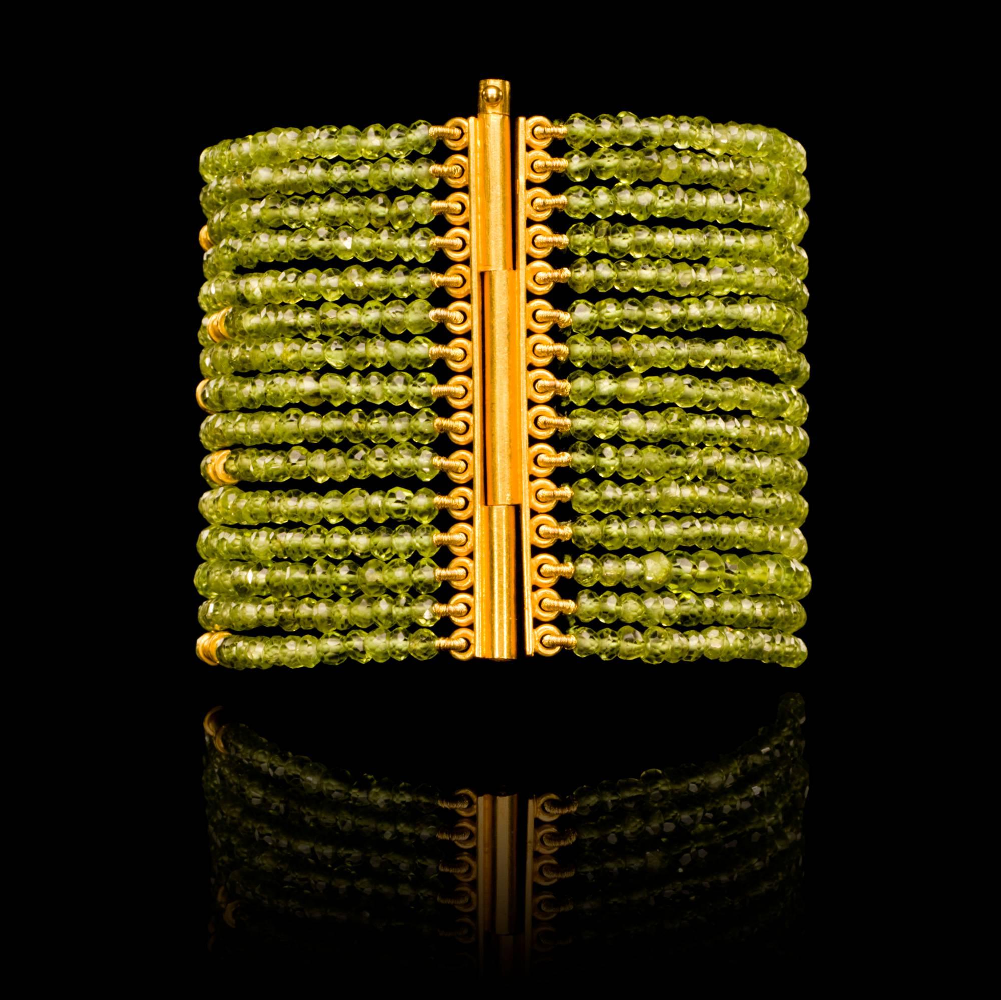 Contemporary Dancing Apsara Peridot and Gold Cuff Bead Bracelet For Sale