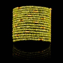 Dancing Apsara Peridot and Gold Cuff Bead Bracelet