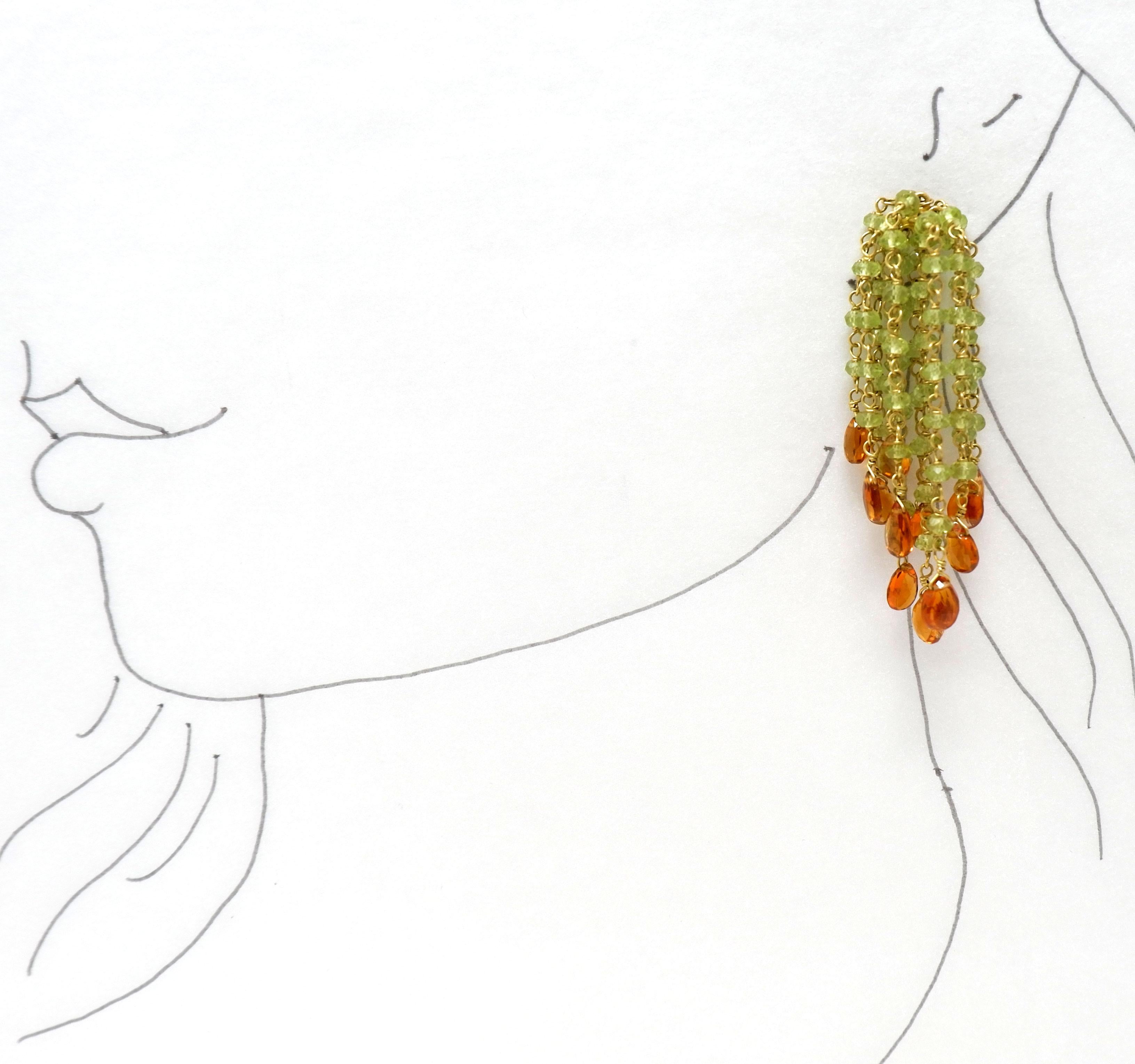 A pair of stylish and versatile hand crafted 18 karat gold Waterfall peridot and citrine bead earrings. Wear them on their own or with our matching peridot bead cuff. Let these elegant earrings effortlessly take you from day to nigh, from beach to