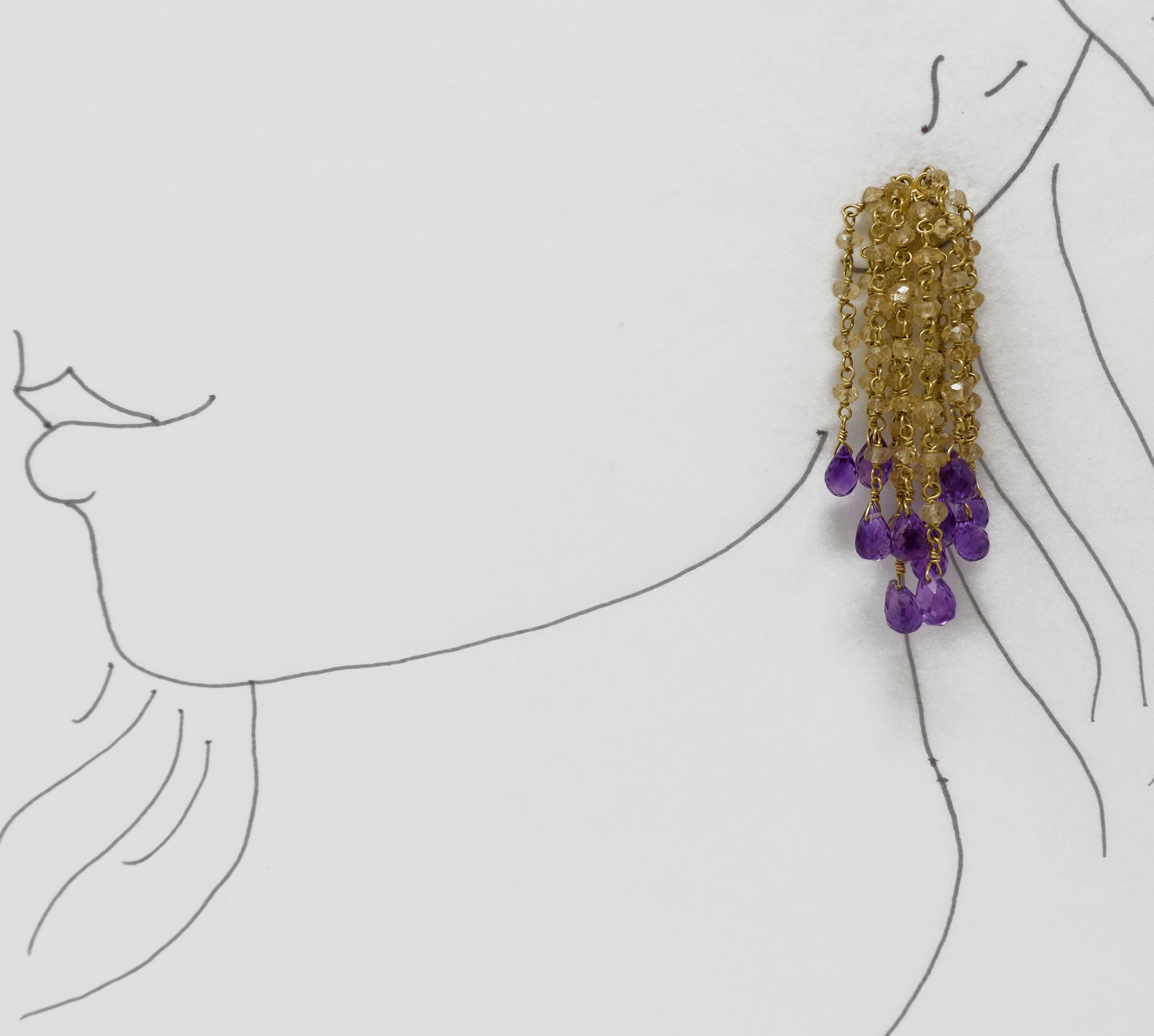 A pair of stylish and versatile hand crafted 18 karat gold Waterfall citrine and amethyst bead earrings. Wear them on their own or with our matching amethyst bead cuff. Let these elegant earrings effortlessly take you from day to nigh, from beach to