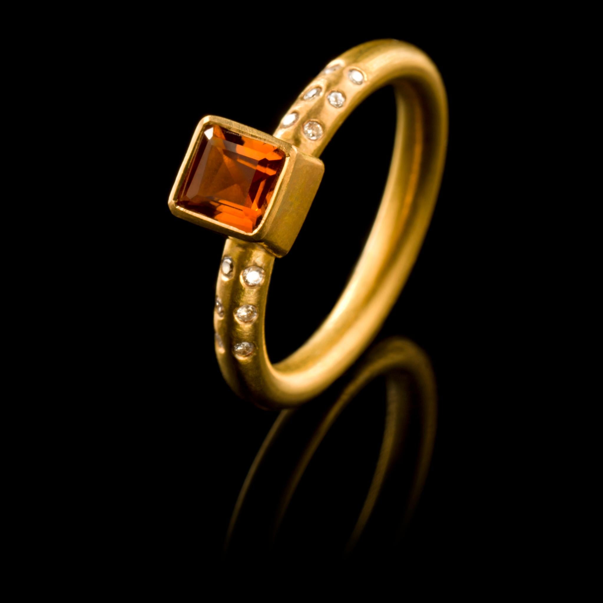 A chic, hand crafted 18 karat matte gold stacking ring with a square cut citrine flanked by six diamonds either side. Size: UK O/P US 7.5 EUROPE 55.5 The ring can be resized. Wear it on its own or with other rings from the collection as shown on our