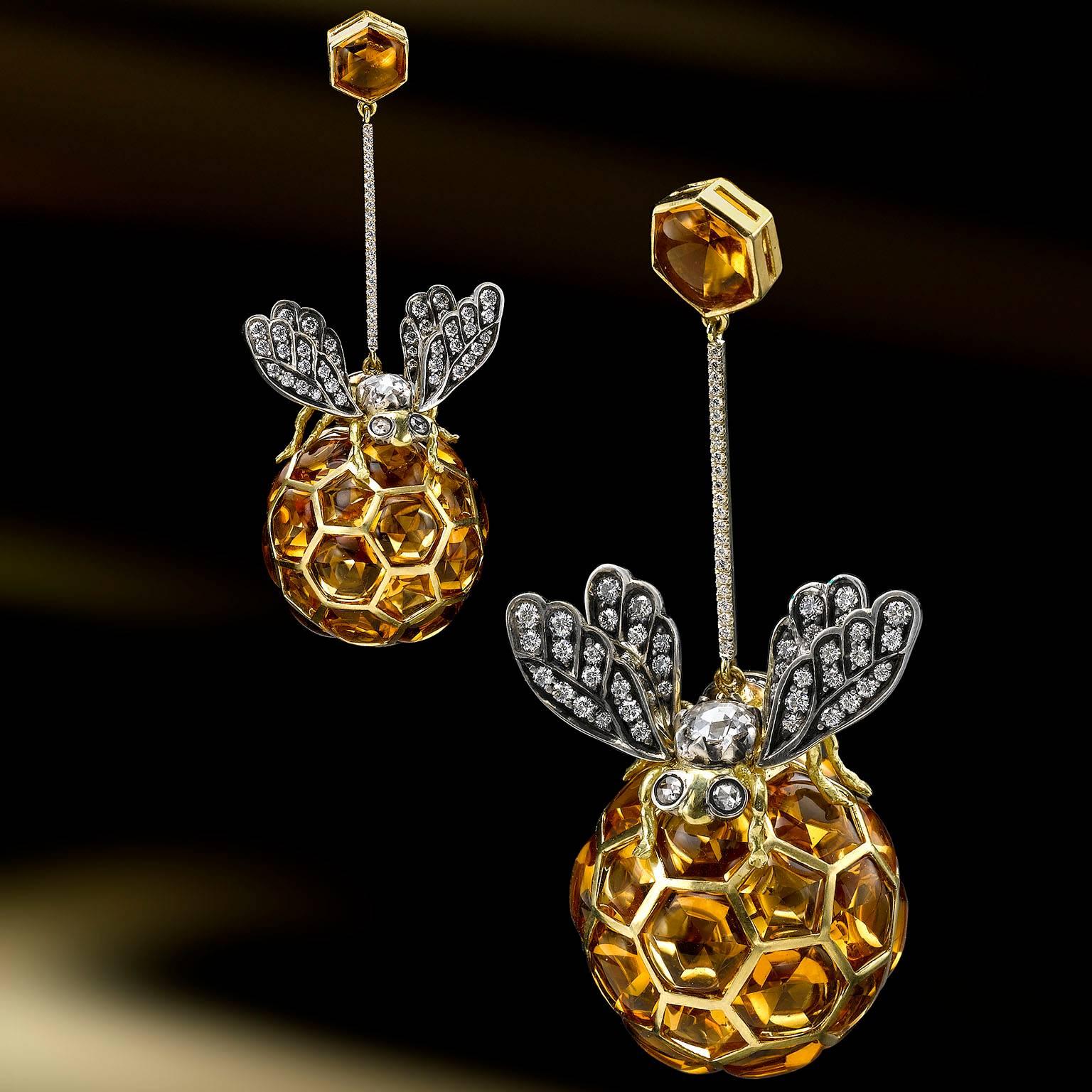 These elegant drop earrings are very light weight for their size and comfortable to  wear. The18k Gold and silver bees set with diamonds and sit on the 18k gold honey balls set with Madeira citrines. Suspended from a honeycomb stud and an 18k. gold