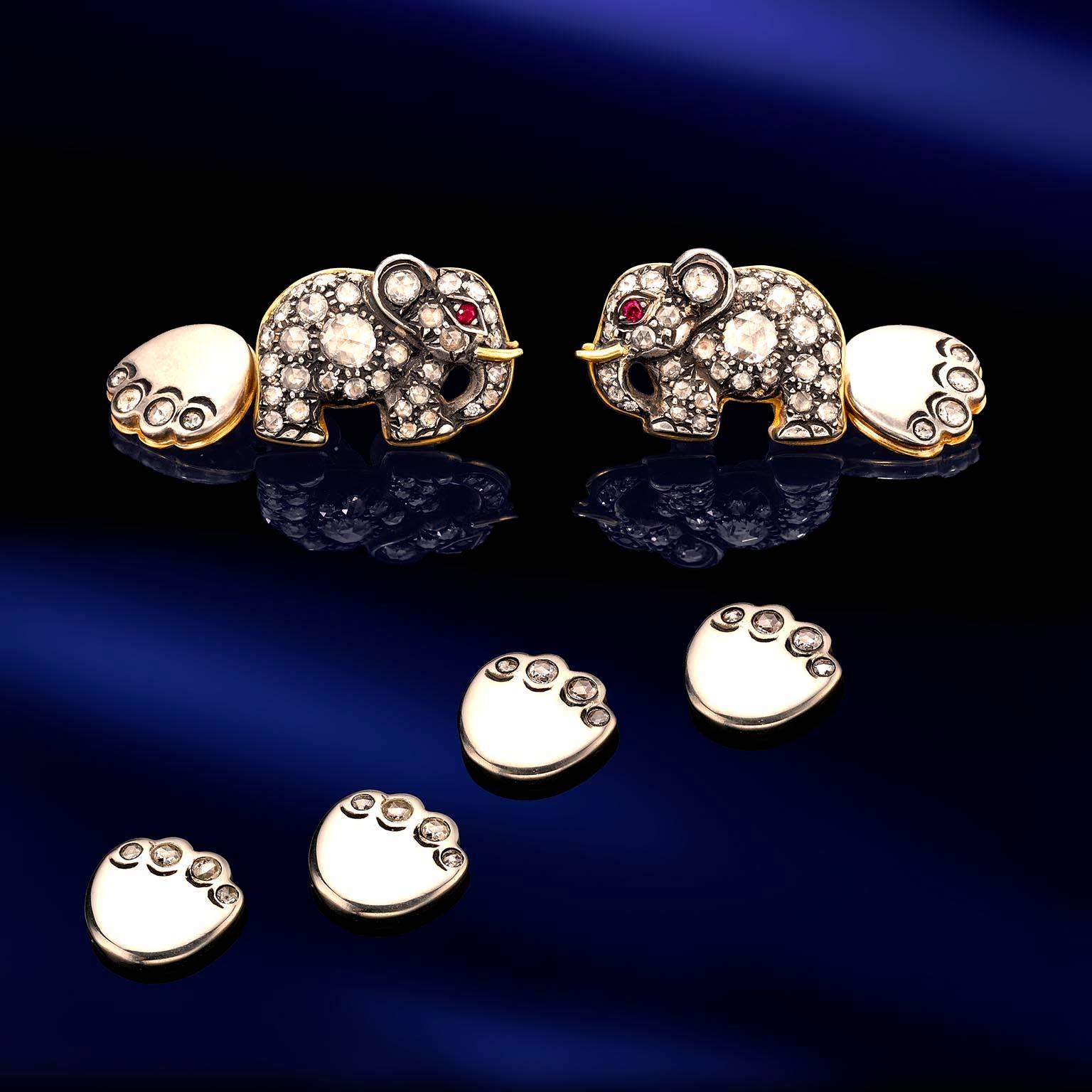 Ruby eyed "Elephants” Cuff Links and studs set carrying 4.5 carats of diamonds set in 18 karat gold toped with sterling silver.
With instructions assured on reverse: “Left Hand”, “Right Hand”.
Brand New Never Been Worn.