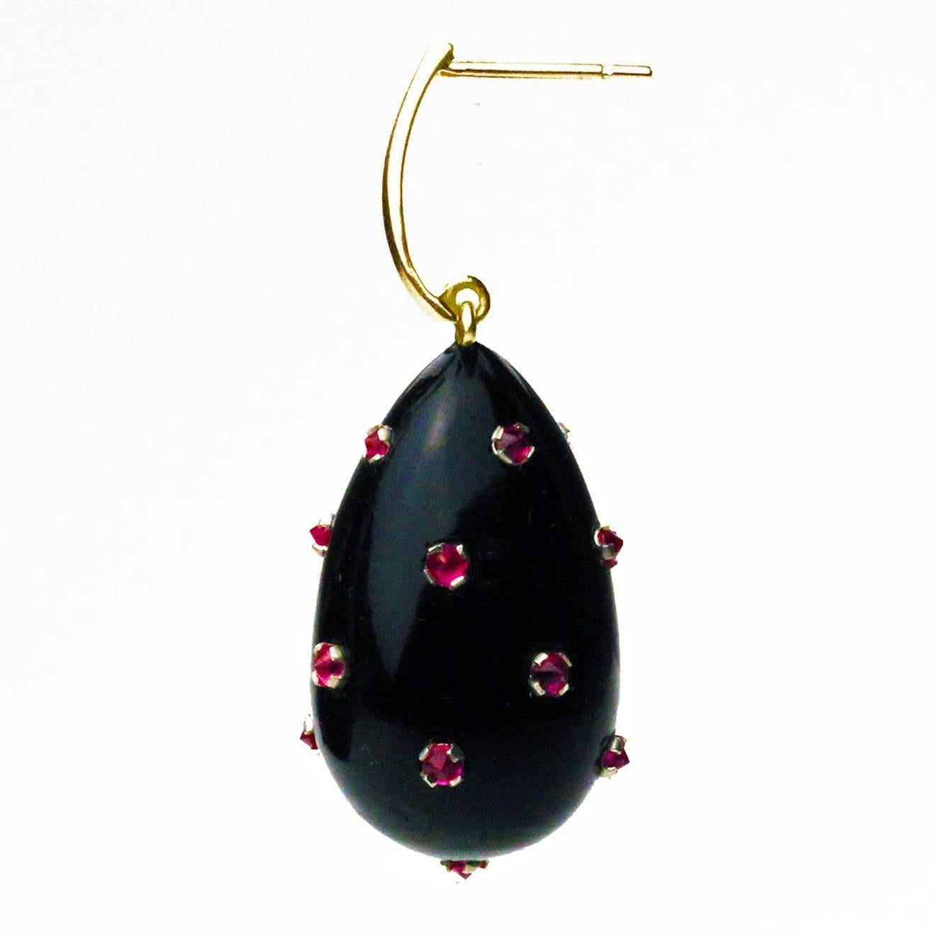 These elegant earrings are inspired by renaissance jewelry. Each earring is a black jade drop incrusted with rubies.  They are light and easy to wear, as well as being extremely versatile.  They can be worn to work and then for an evening out on the