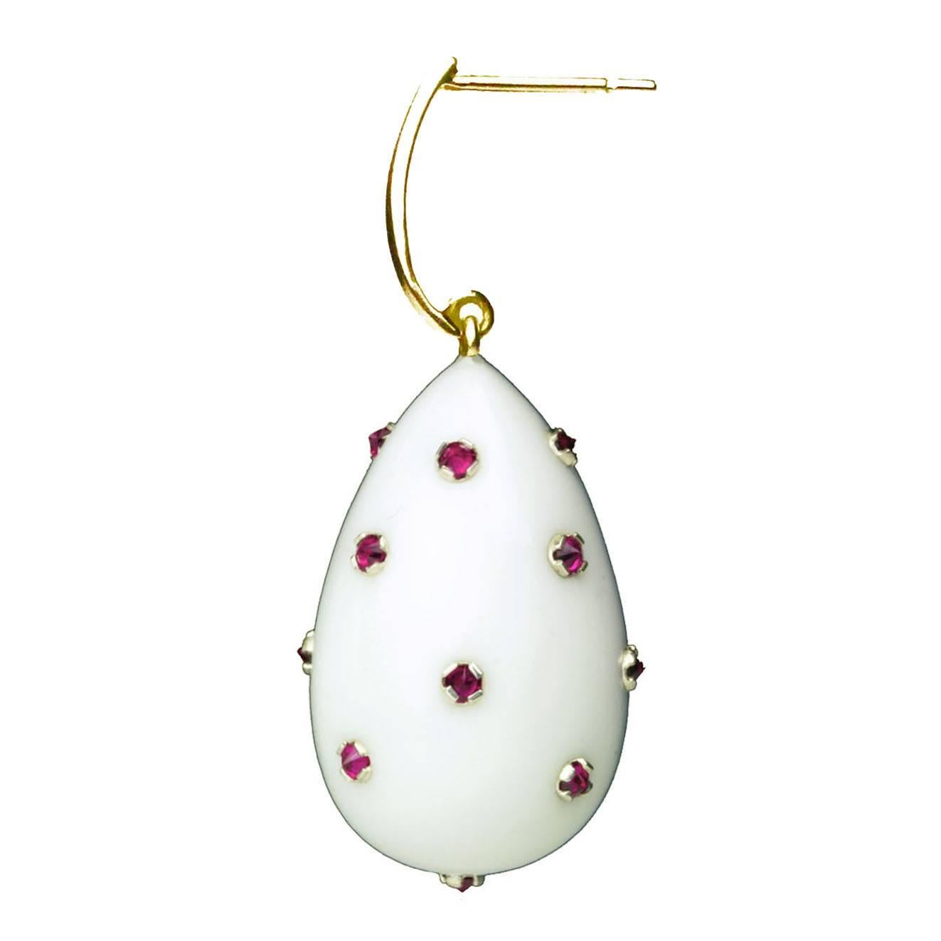 These elegant earrings are inspired by renaissance jewelry that had small stones incrusted into the piece. White Agate has been carved into a drop and with rubies on 18 carat gold tops.  They are light and easy to wear, as well as being extremely