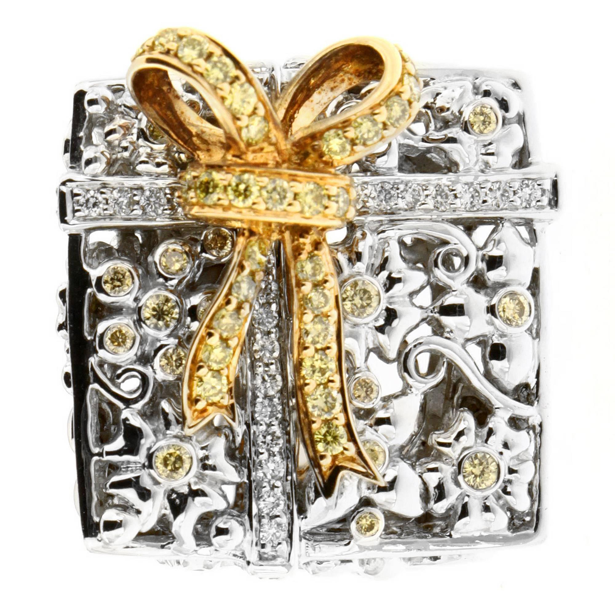 Indulge in Zorab's square cocktail ring featuring 1.06 carats of yellow diamonds and 0.67 carats of white diamonds set in Palladium and 18 Kt Gold metalwork of floral engravings. This luxurious piece is is wrapped in a golden bow set with yellow