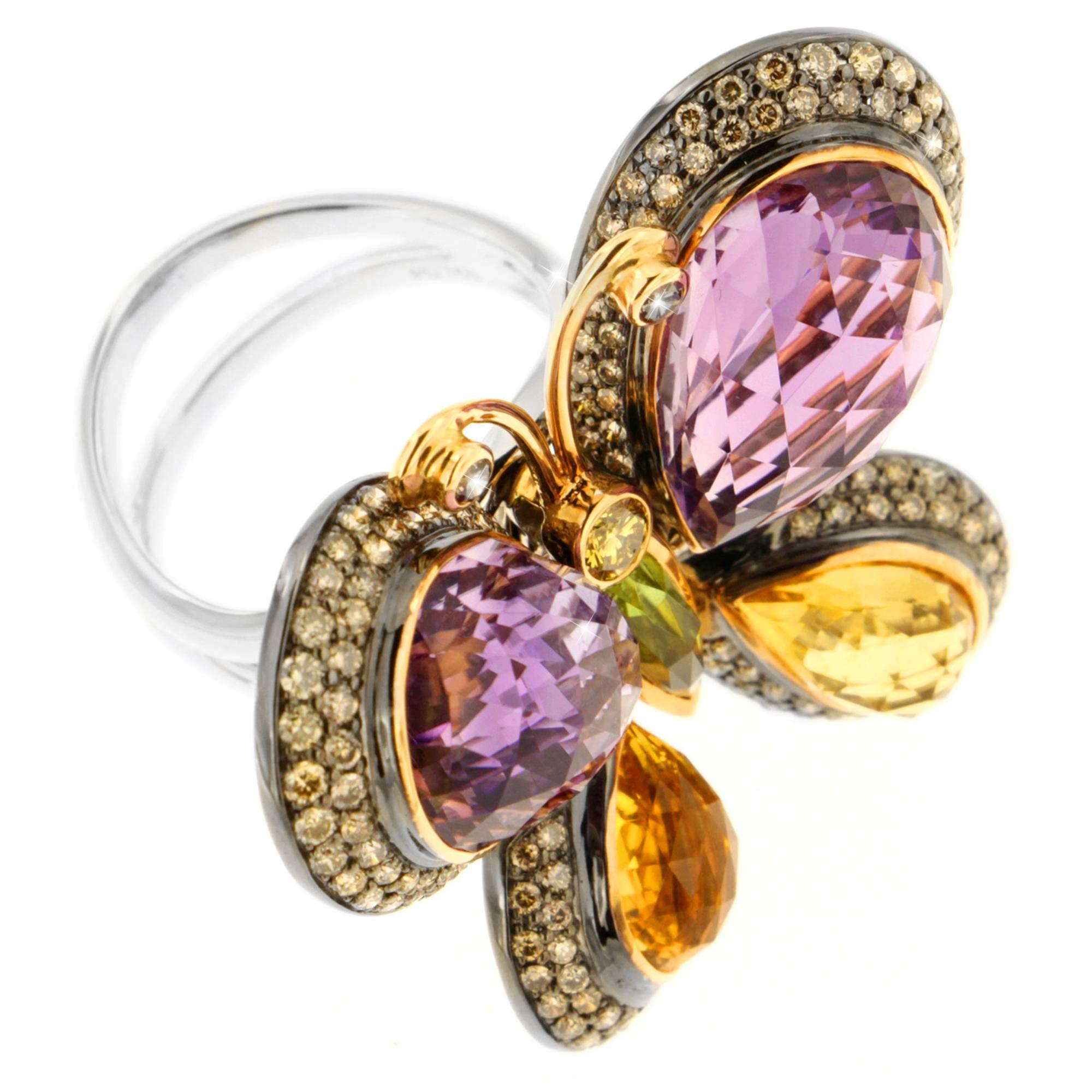 When you possess this ring, something more than your heart will be a flutter.  This artfully designed ring offers interactivity within its glowing amethyst 16.80 carats, Peridot 0.72 carats and 3.93 carats of citrine quartz faceted butterfly wing