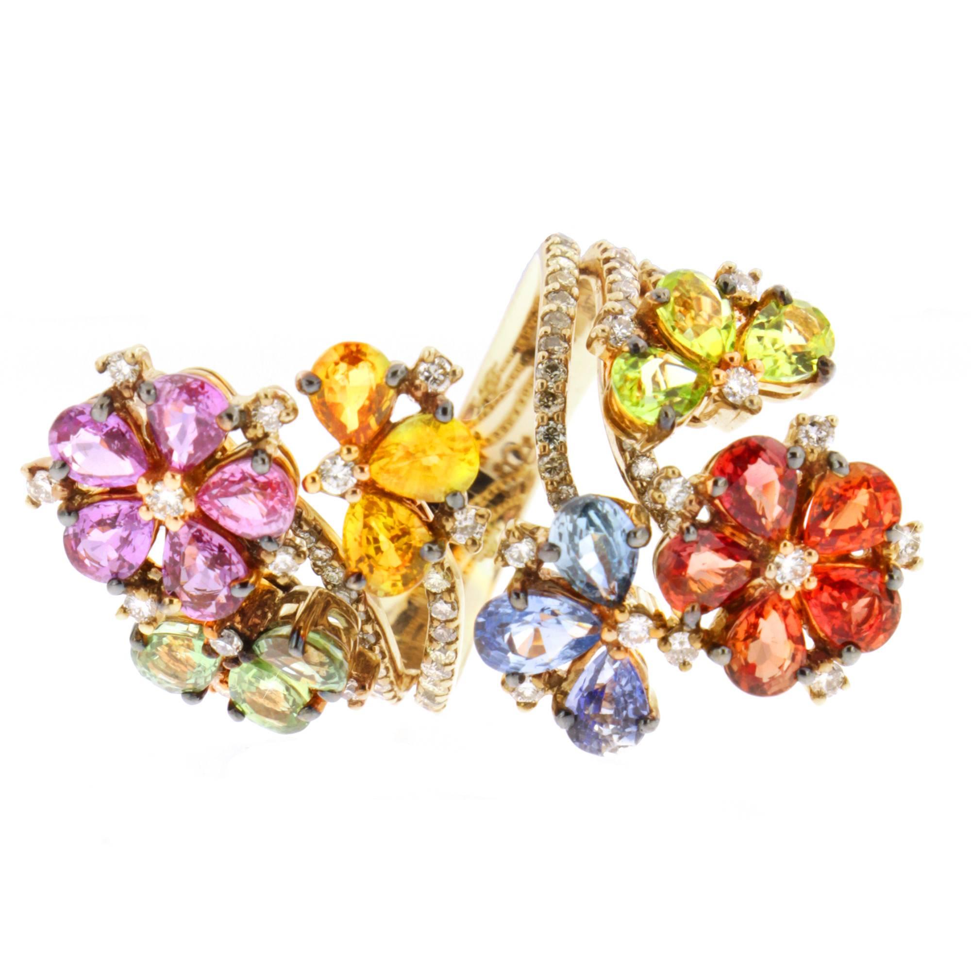Spring ushers in a colorful floral array reminding us life is to be savored.

Bursting from 18-karat gold are the brightest of gemstone hues within the Sapphire Spring ring, a Zorab Creation. 1.45 carats of fancy sapphires engage with blue sapphires