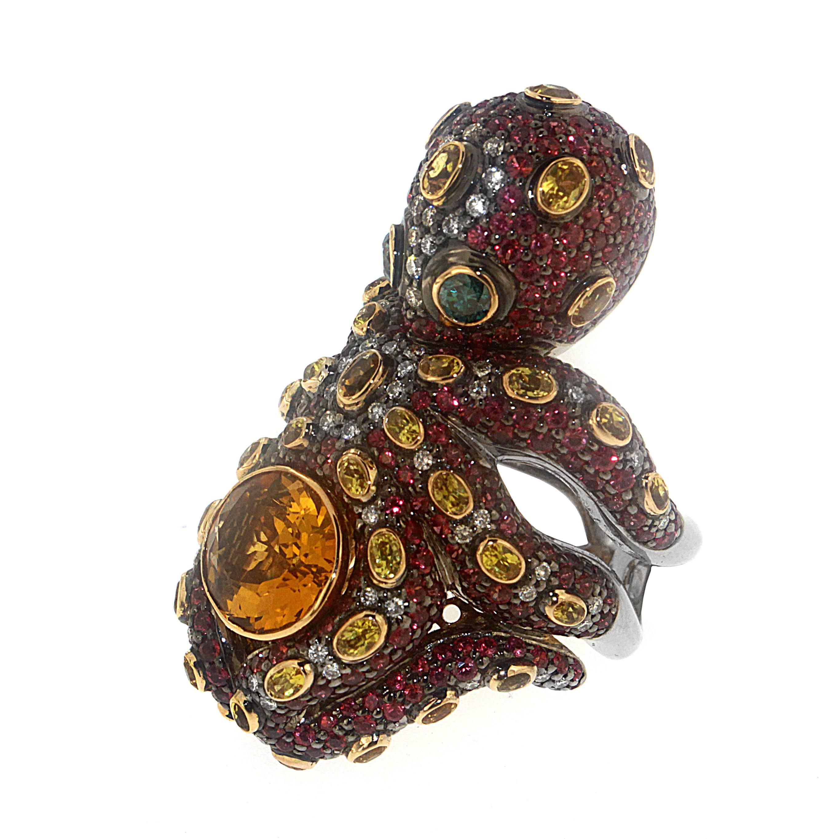 Bask in the warm glow of 5.20 Carats of Citrine Quartz set as the center stone in this one of a kind whimsical creation. The octopus' tentacles wrap around your finger and display the full magnitude of 10.52 Carats of Red Sapphires, 4.36 Carats of